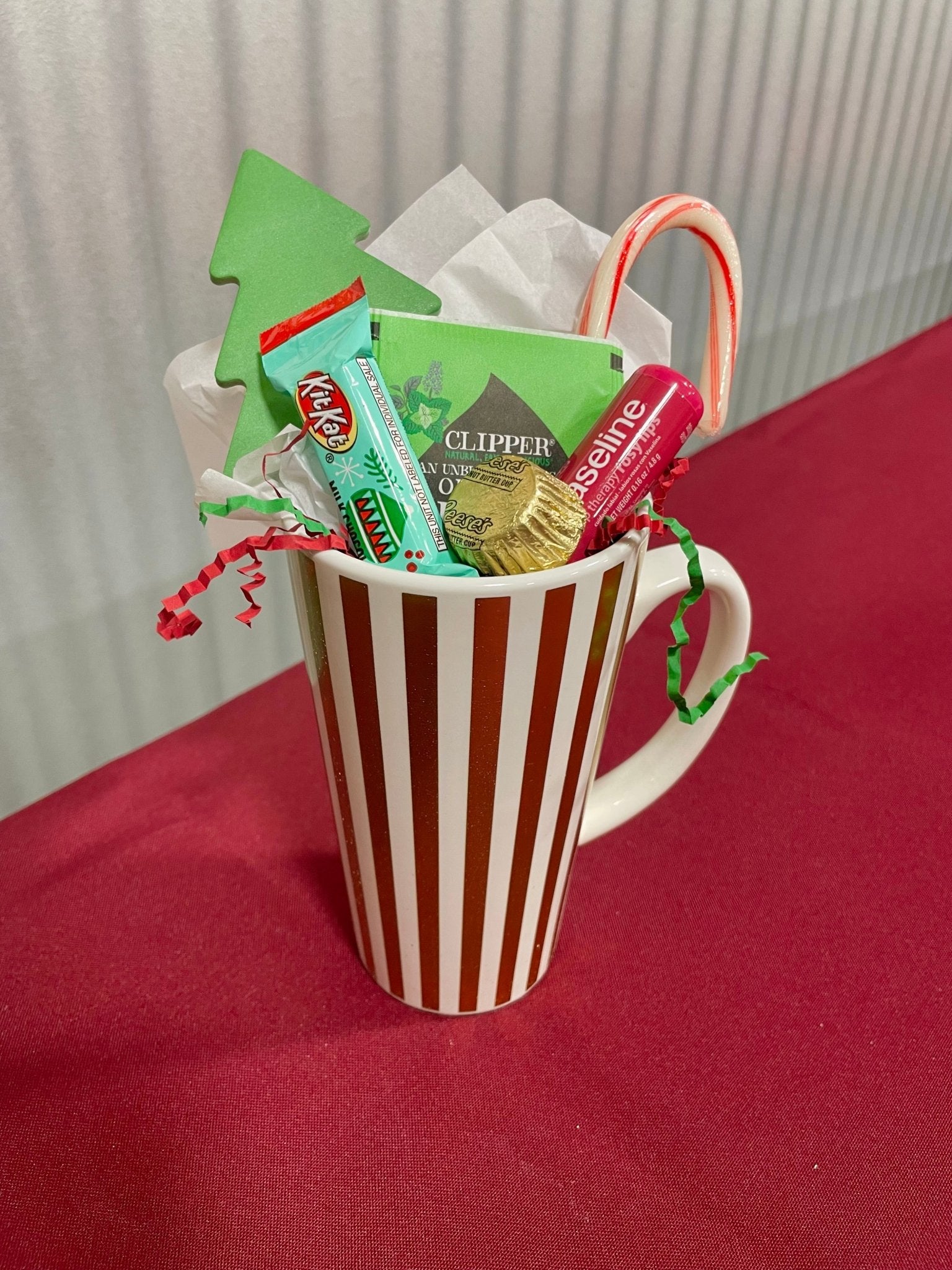 Christmas mug gift basket: hot cocoa, candy cane, KitKat, Vaseline, Main Street Collective.