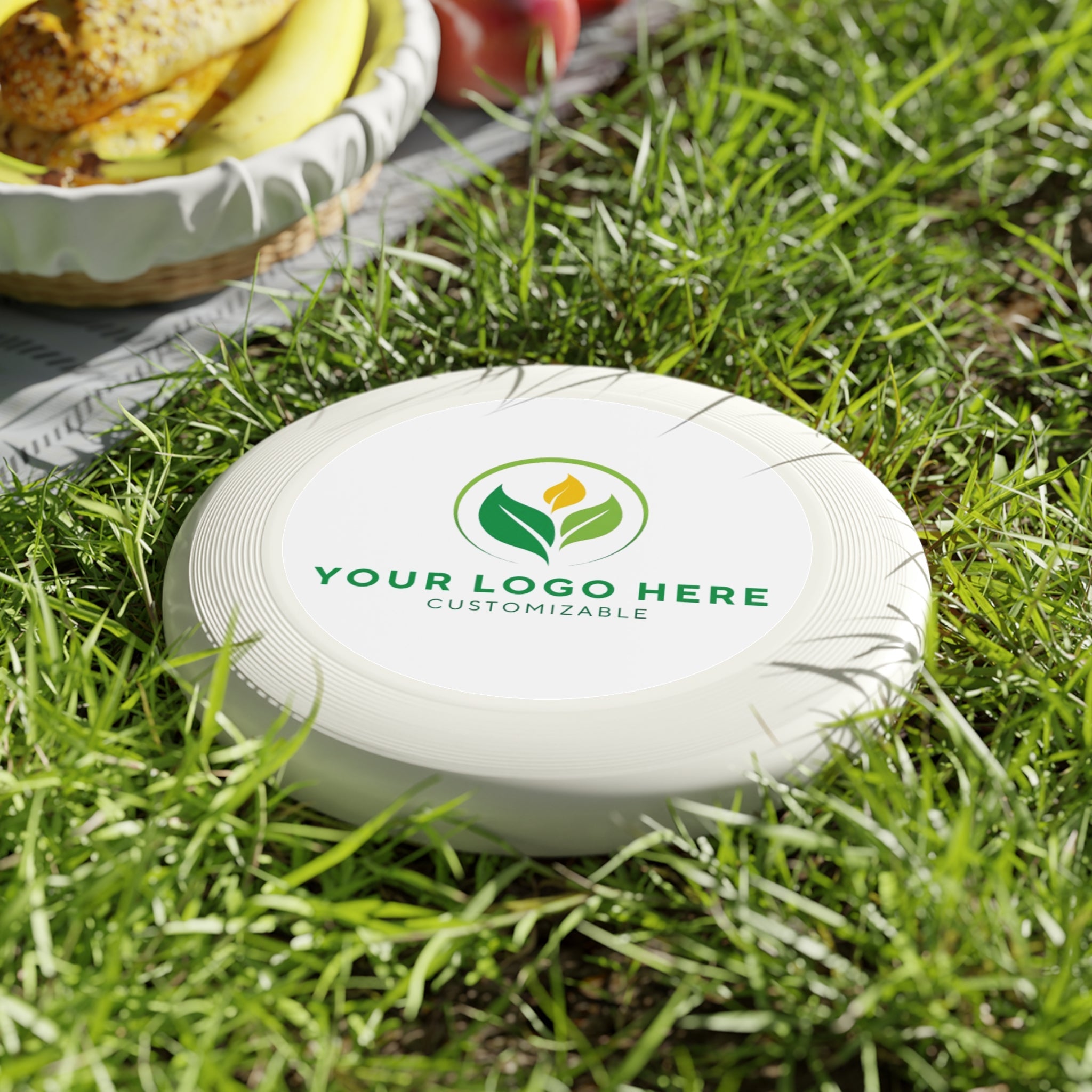 Custom Frisbee in Grass - Promotional Product by Main Street Collective