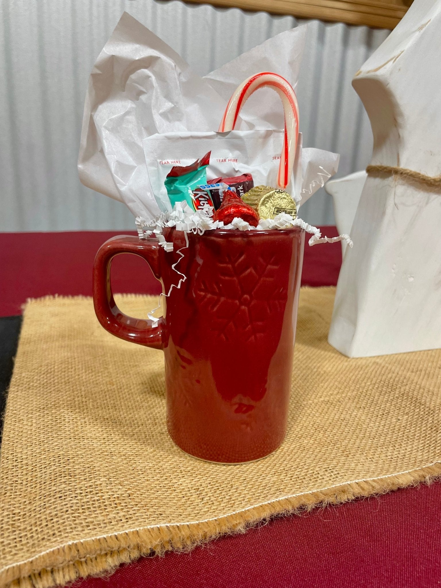 Maroon Mississippi State Merry Mug with hot cocoa, peppermint stirrer, and holiday candy from Main Street Collective.