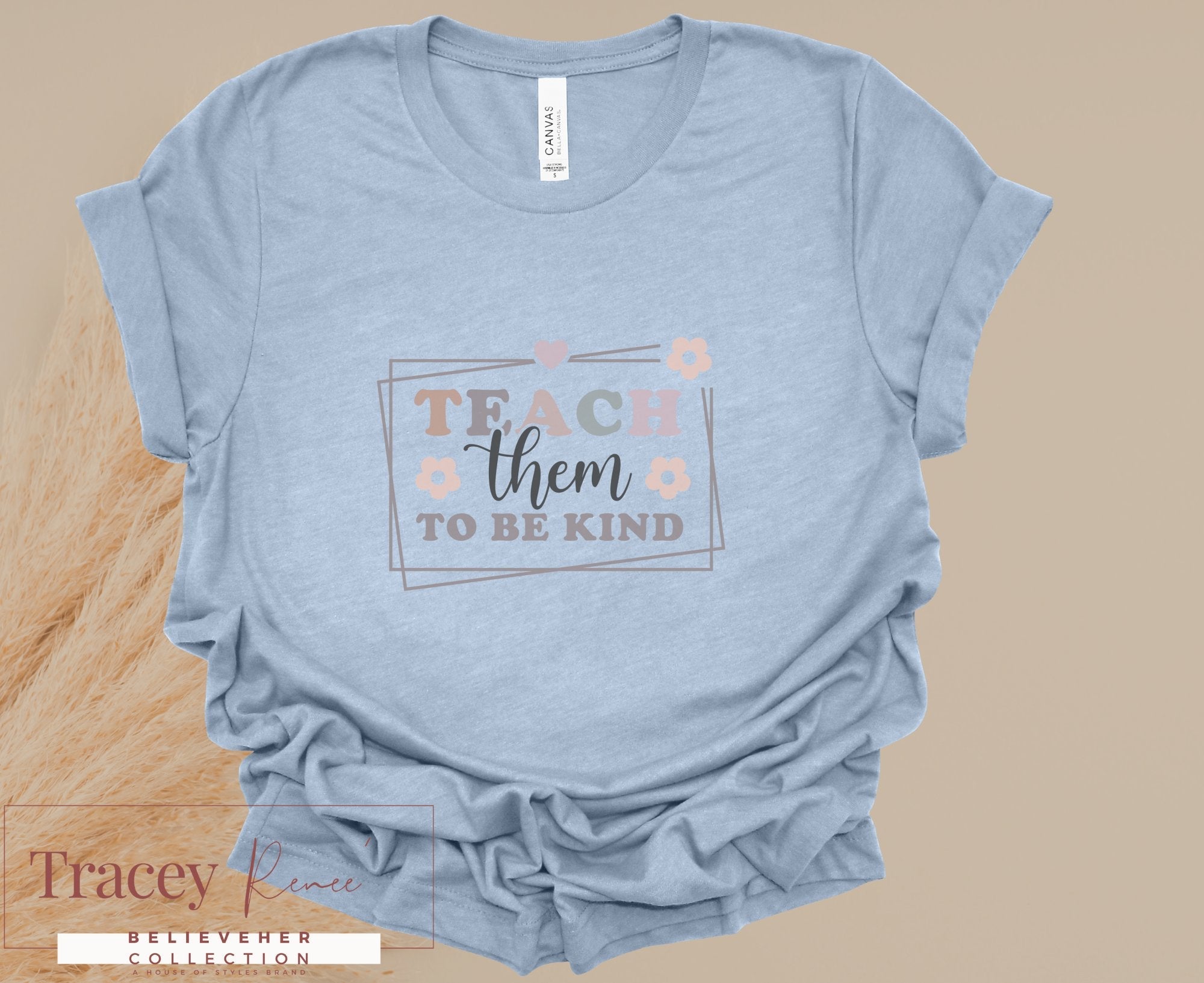 Light Blue T-Shirt with "Teach Them To Be Kind" Design | Spring Collection for Educators by Tracey Rince