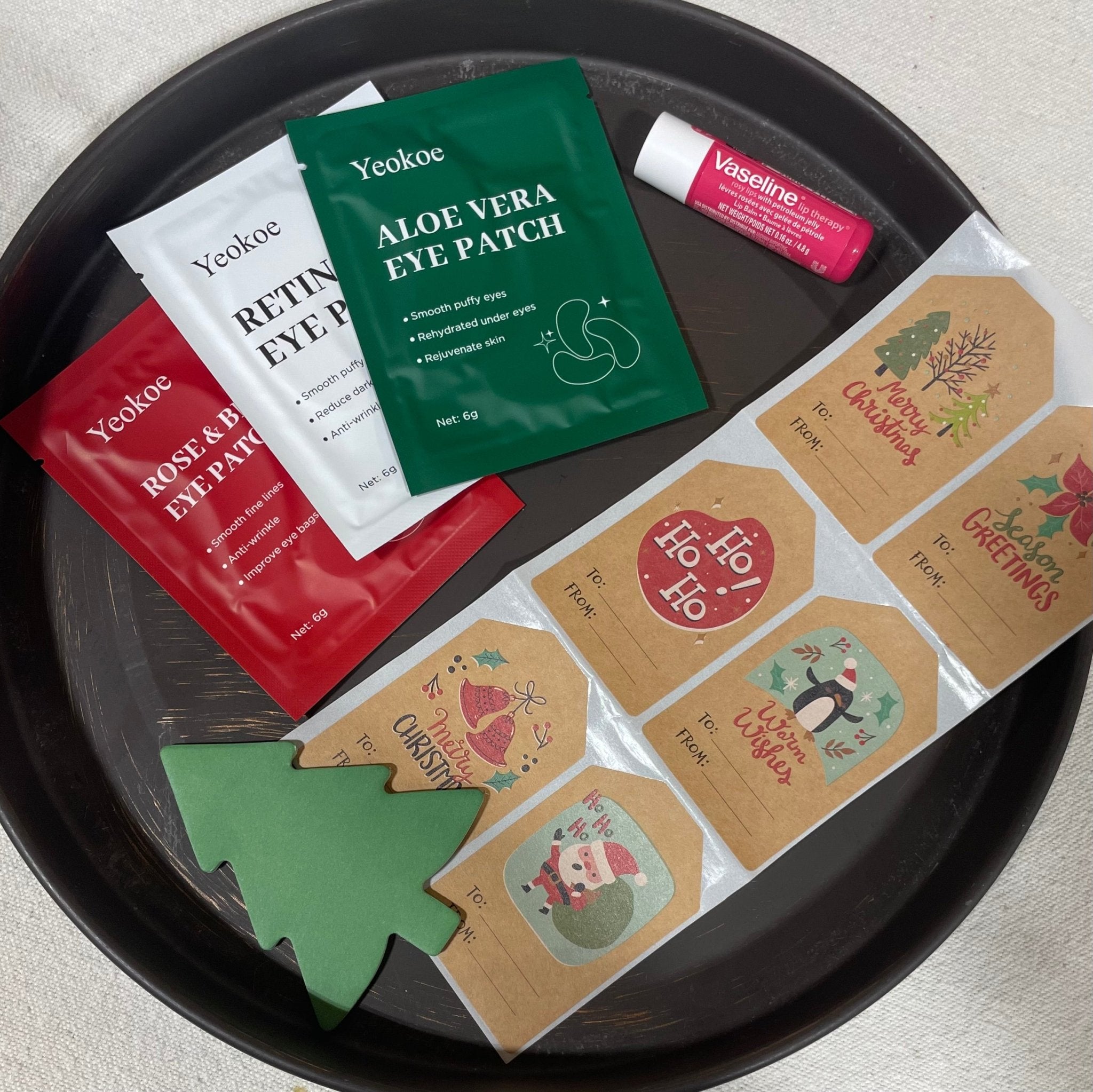 Christmas Self-Care Gift Set: Eye Patches, Lip Balm, & Gift Tags by Yeokoe. Holiday gift box for relaxation and pampering.