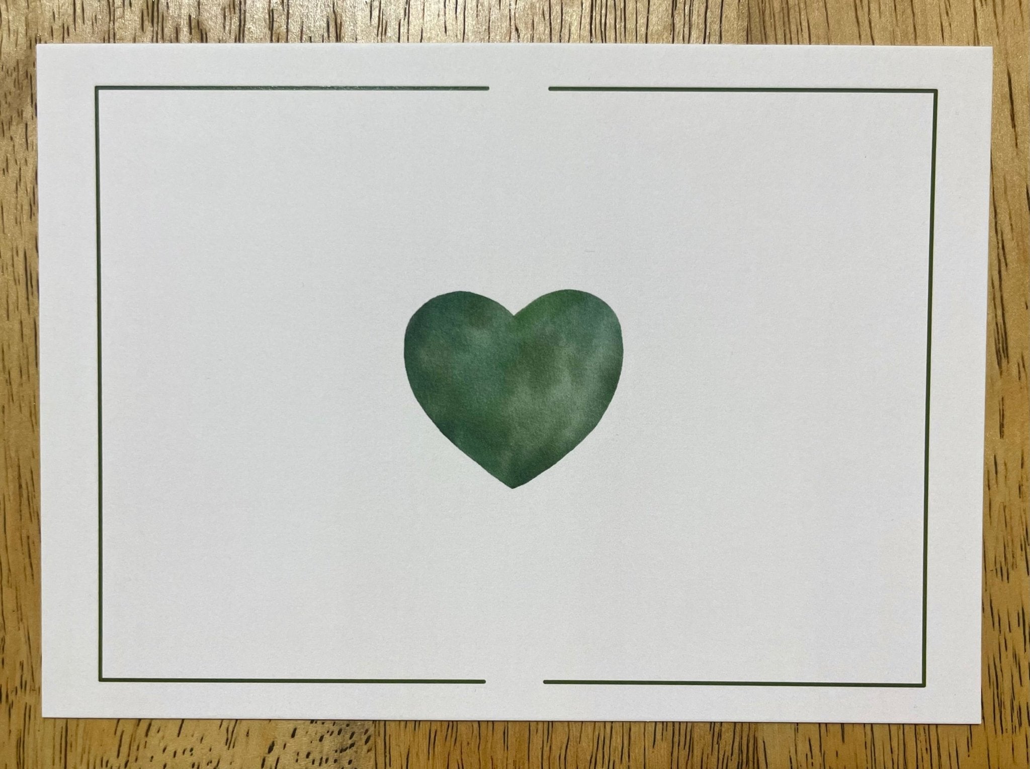 Minimalist card with green heart by Main Street Collective. Blank greeting card for love, support, and kind wishes.