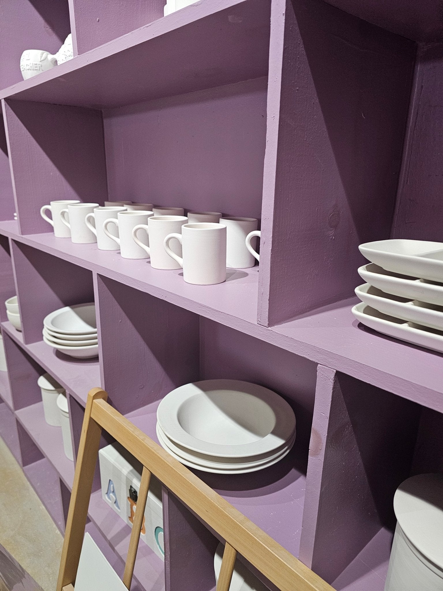 Handmade Pottery: Mugs & Plates on Lilac Shelves | Ceramic Art Display