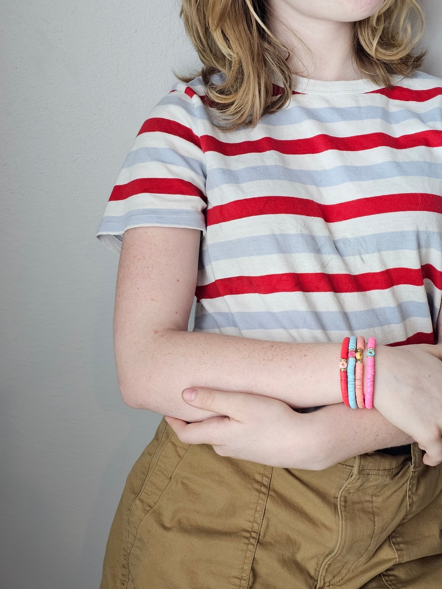 Bright Heart Bracelet Stack - Main Street Collective: Tween girl's colorful beaded bracelets with heart charms, red, pink, and blue.