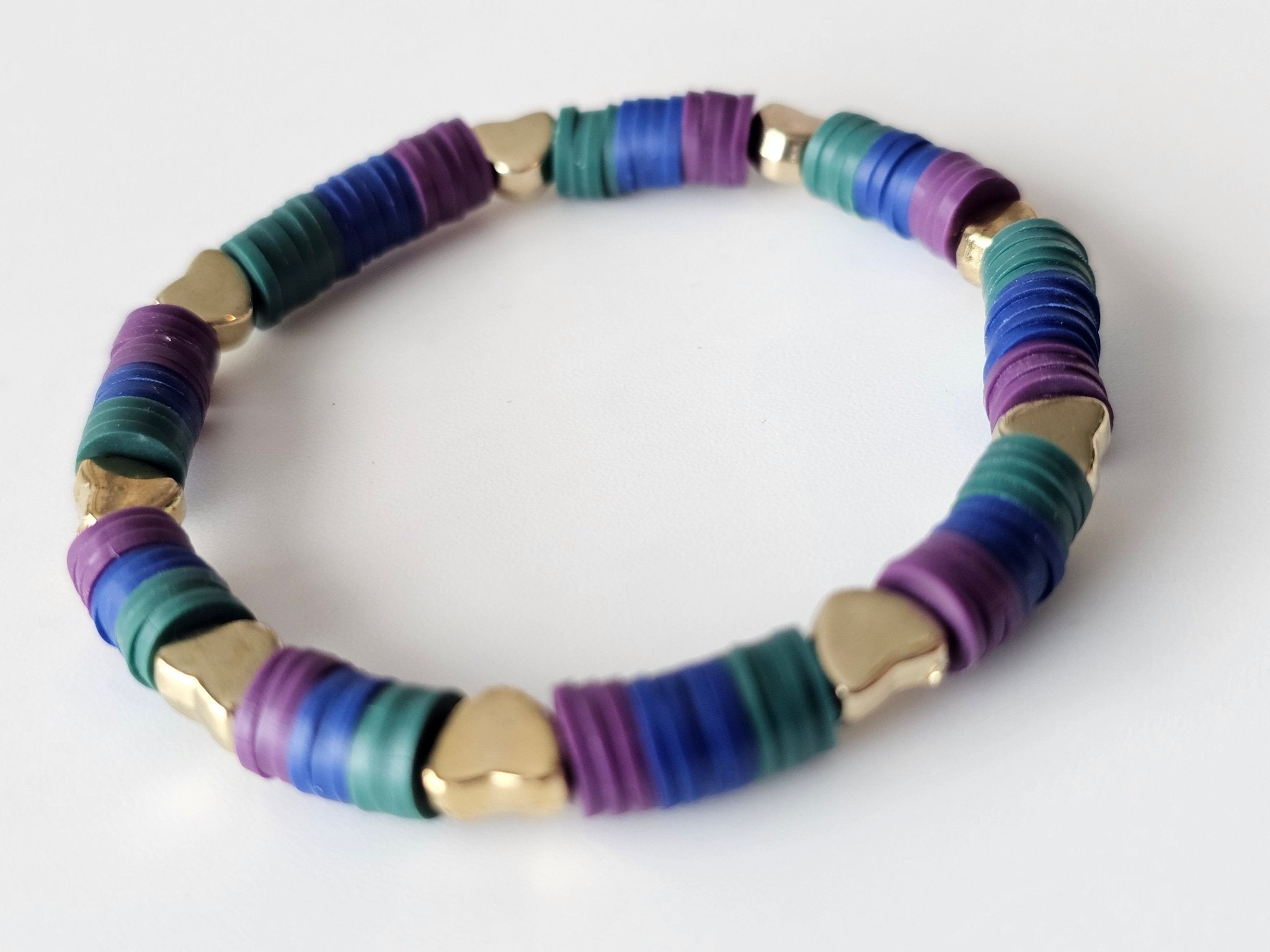 Colorful Beaded Bracelet: Teal, Indigo, Plum Disc & Gold Heart Beads. Stretchy Tween Fashion Jewelry by Main Street Collective.