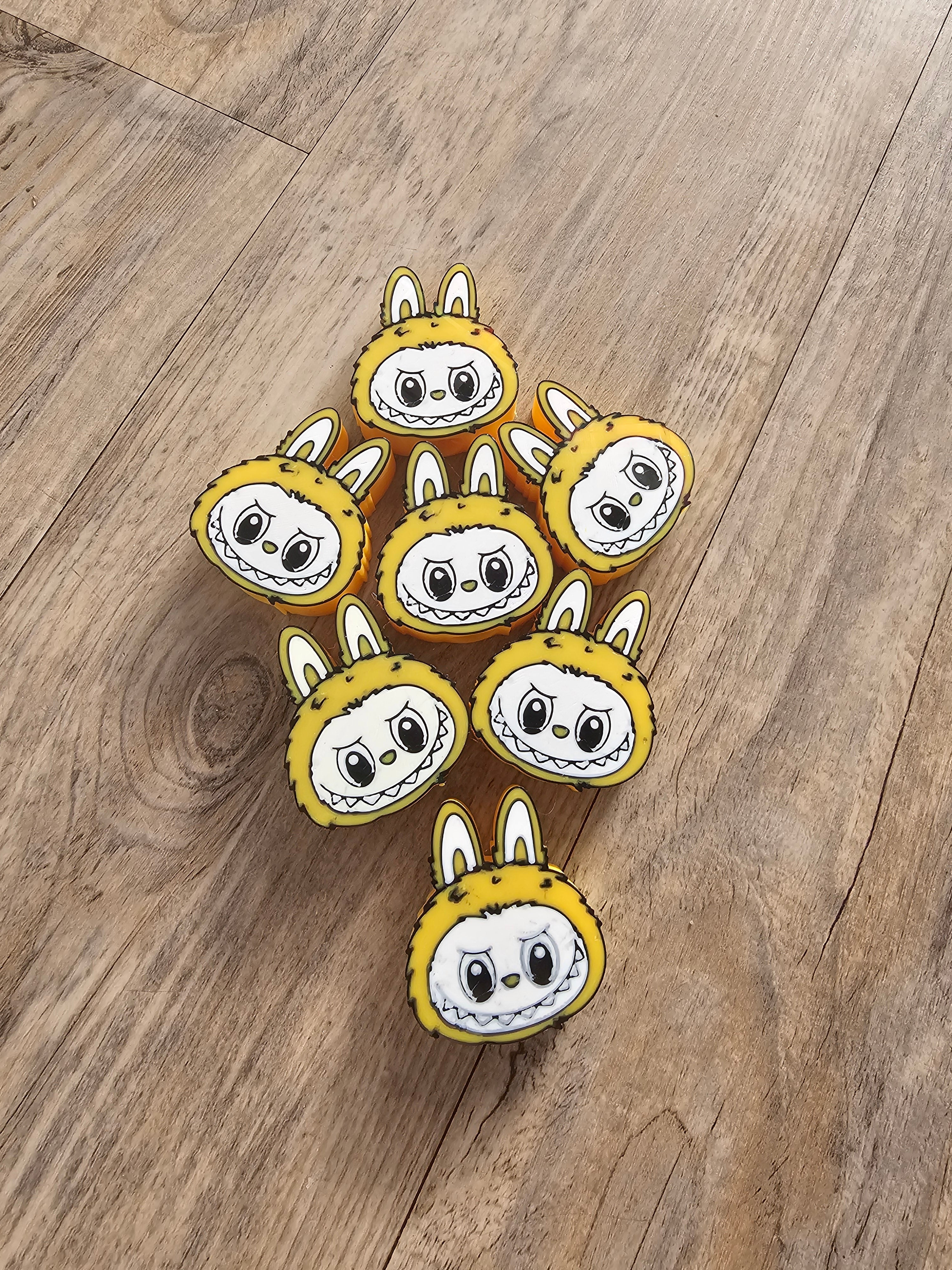 Group of Yellow Bunny Monster Straw Toppers handmade by Main Street Collective, 3D-printed and uniquely cute.