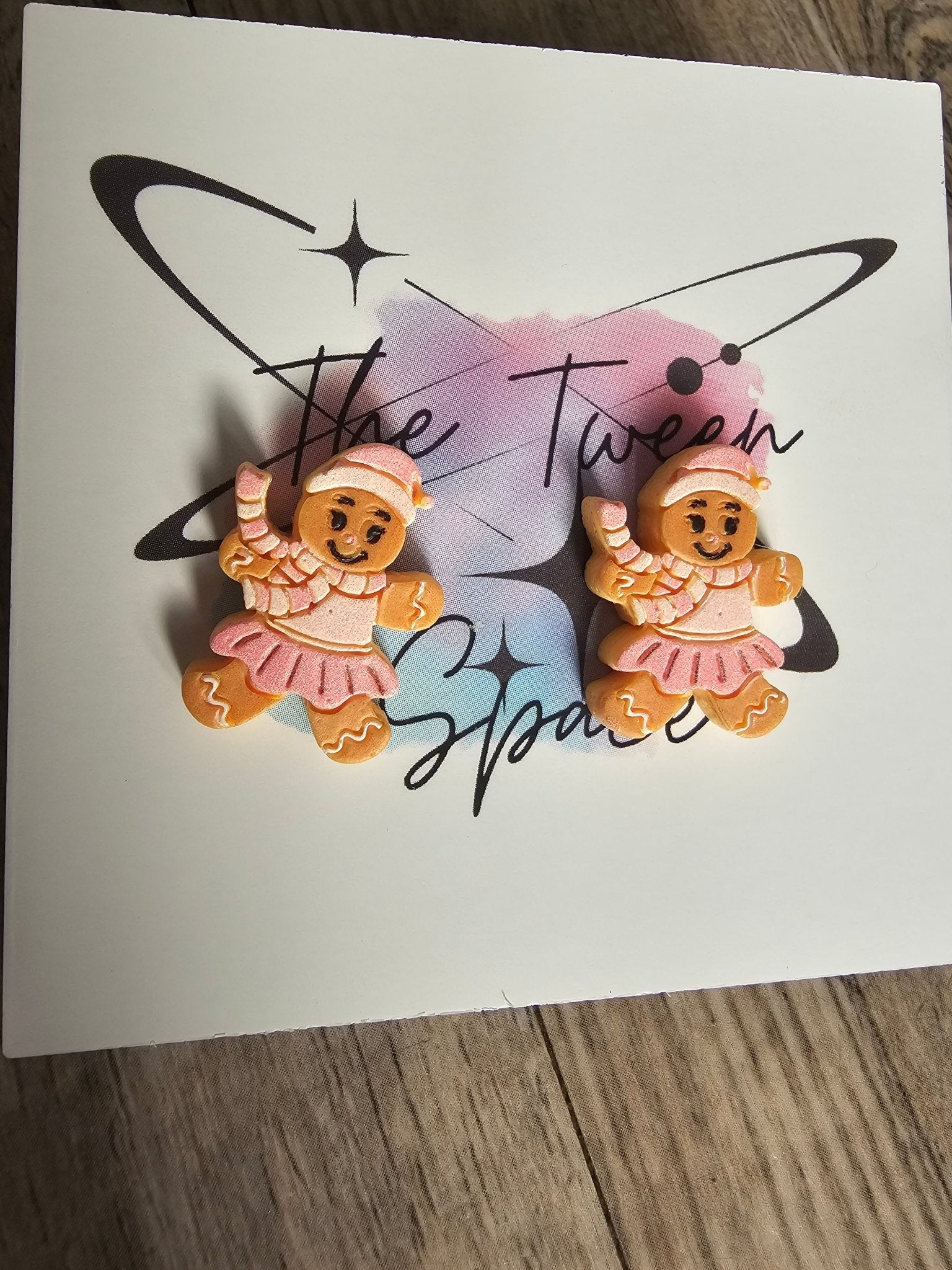 Christmas Cookie Stud Earrings: Two Gingerbread Girl Earrings by The Tween Space at Main Street Collective. Pink & White Holiday Jewelry