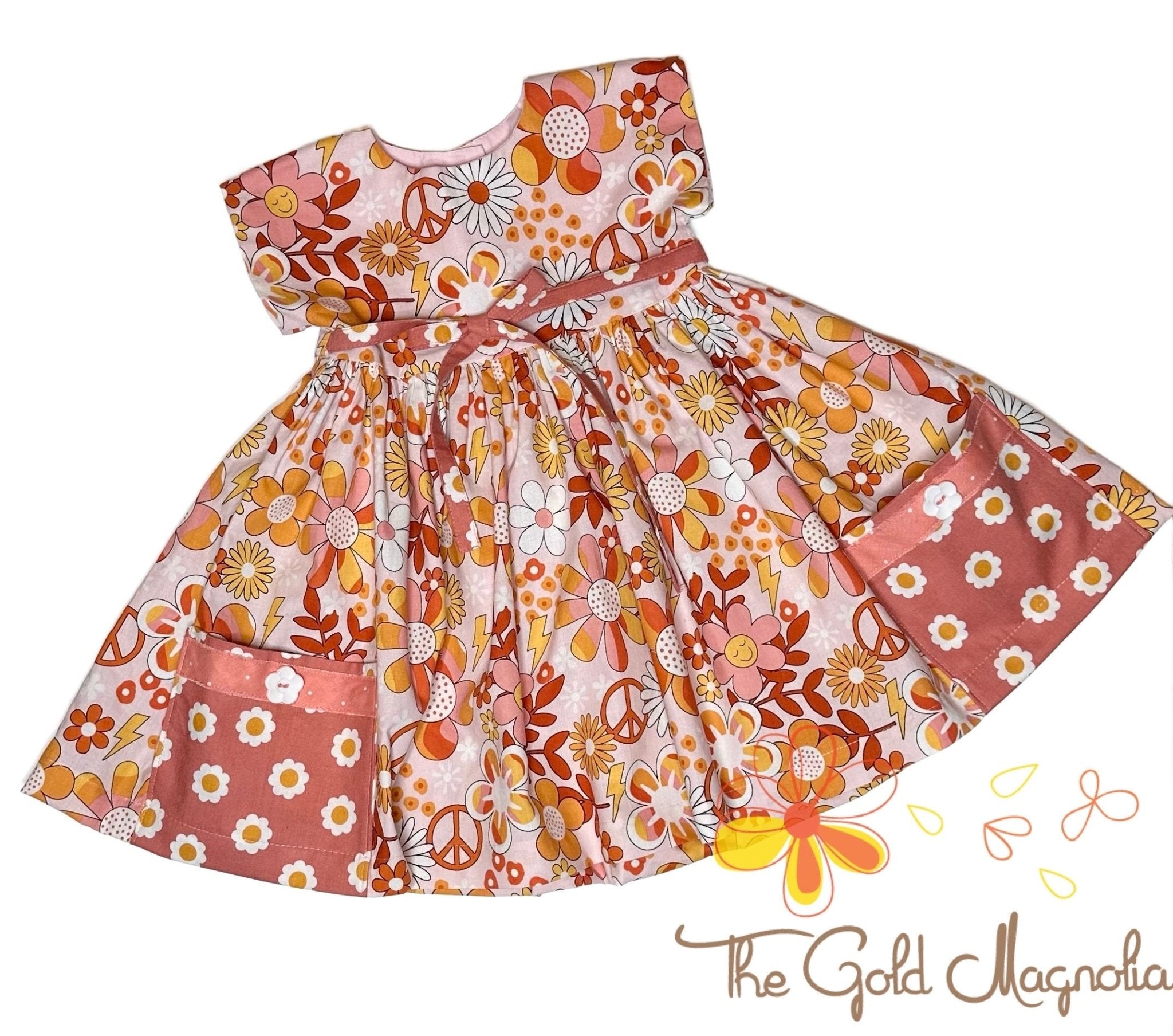 Girls' Groovy Vibes Dress: Retro floral print dress with pockets, sizes 2T-14. Main Street Collective.