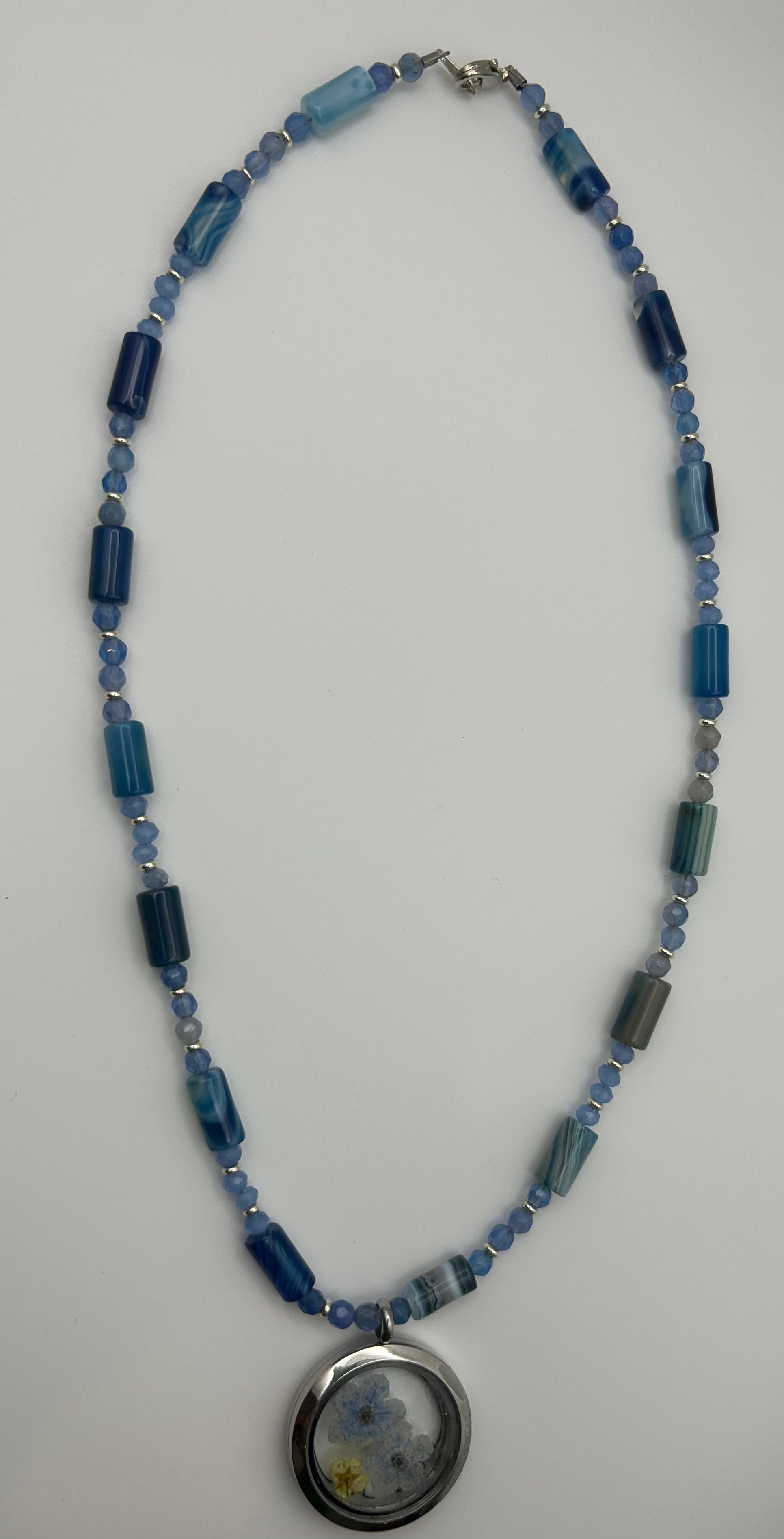 Soulful designs 18" necklace with Blue Agate beads with resin and dried flower charm