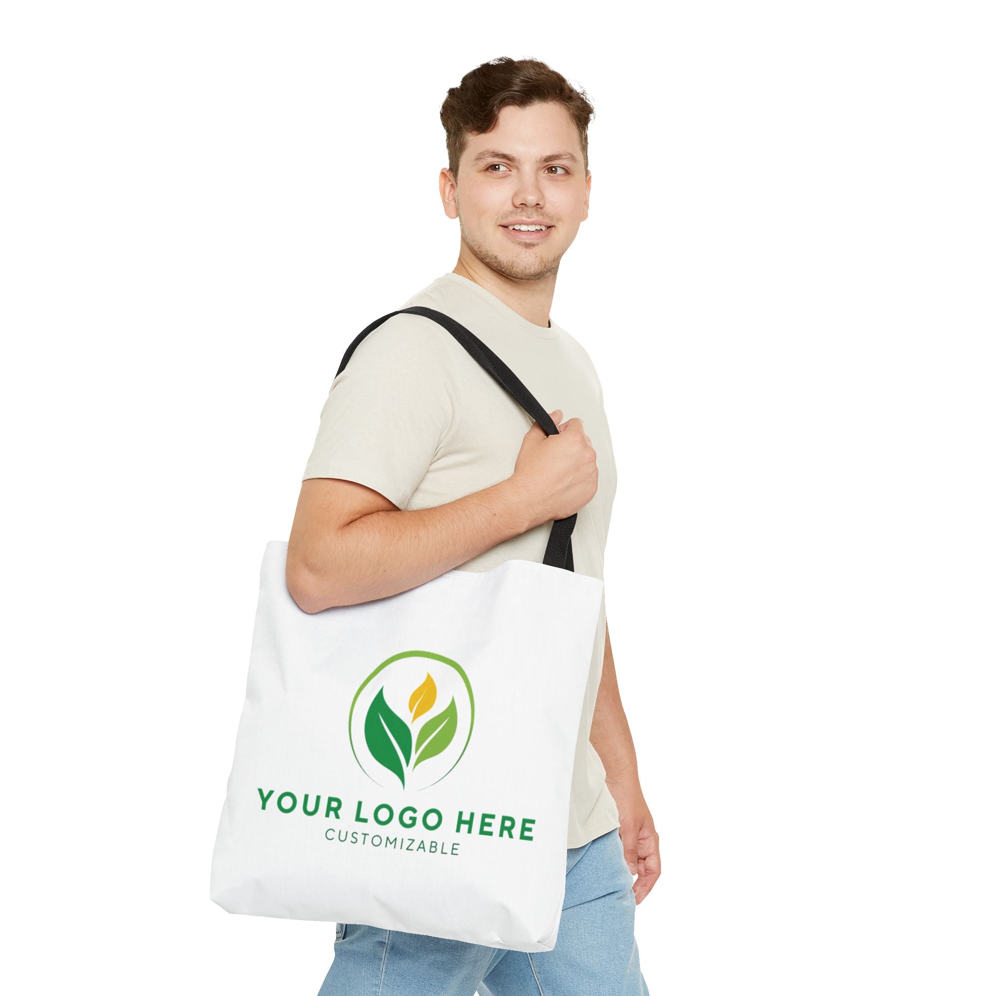 Man holding customizable tote bag with logo. Personalized bag for branding.