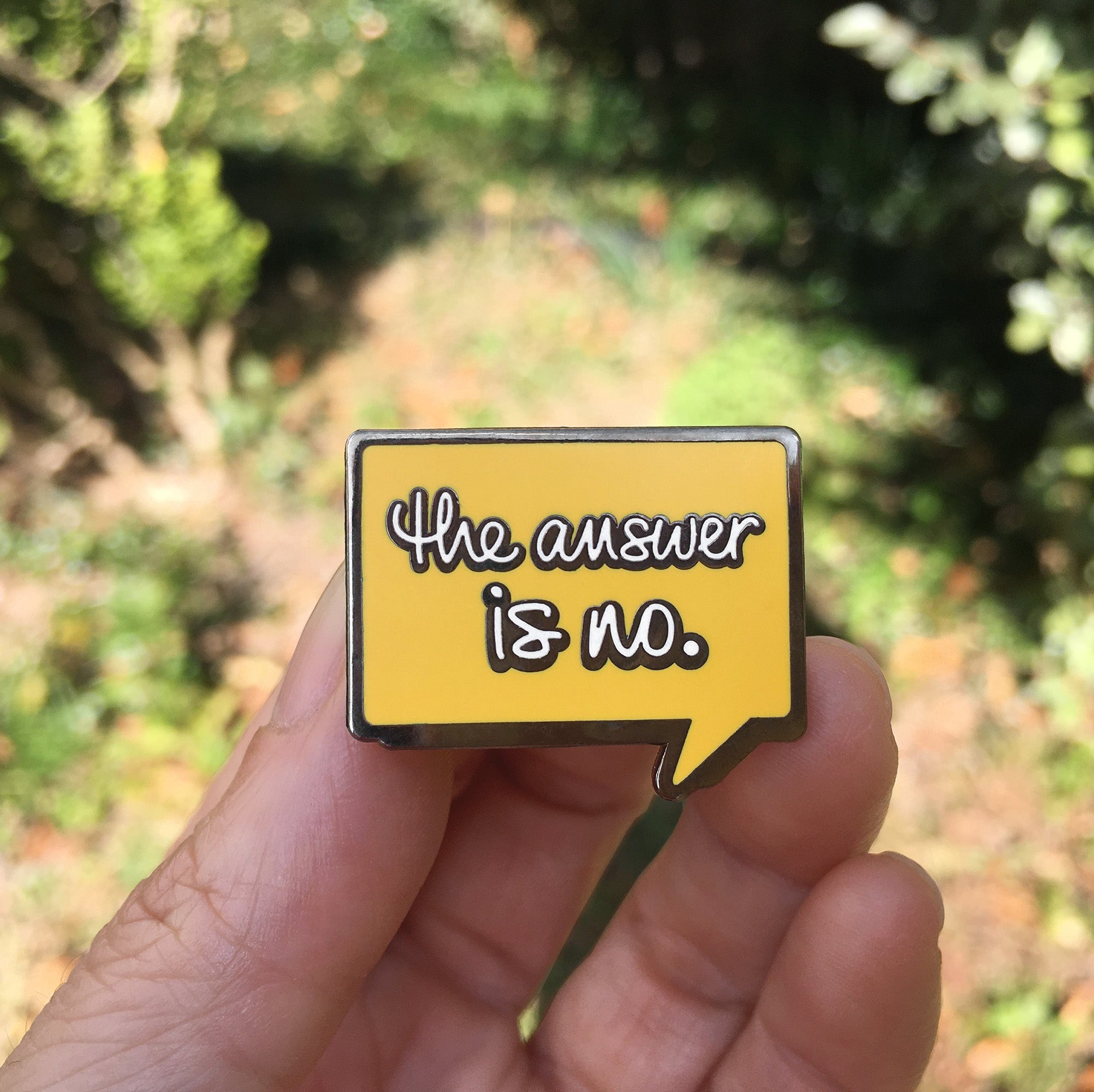 “The Answer Is No” Enamel Pin – Funny Boundary-Setting Speech Bubble