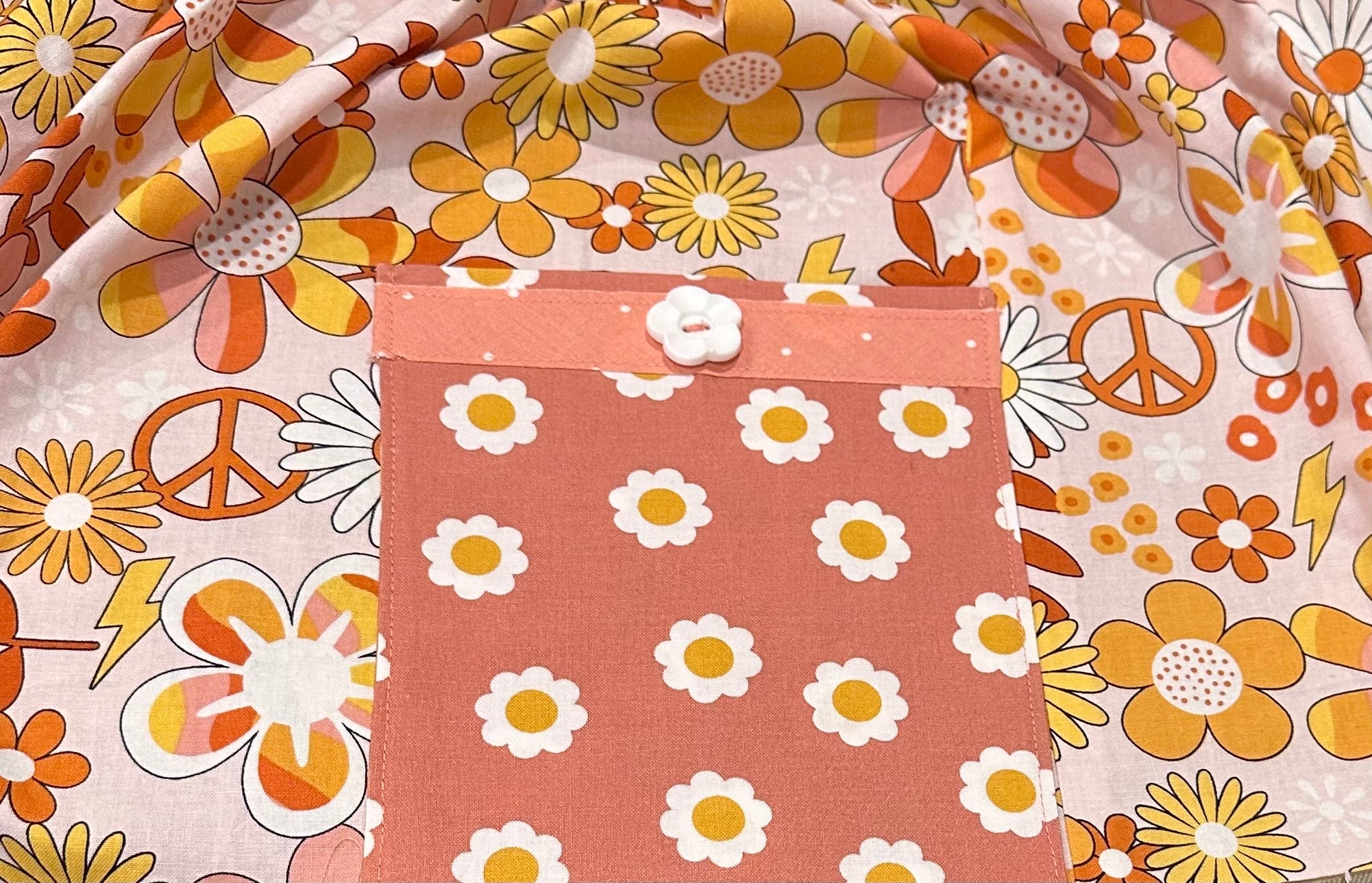 Groovy girls dress with floral print, pocket, and button. Retro 70s style dress from Main Street Collective.