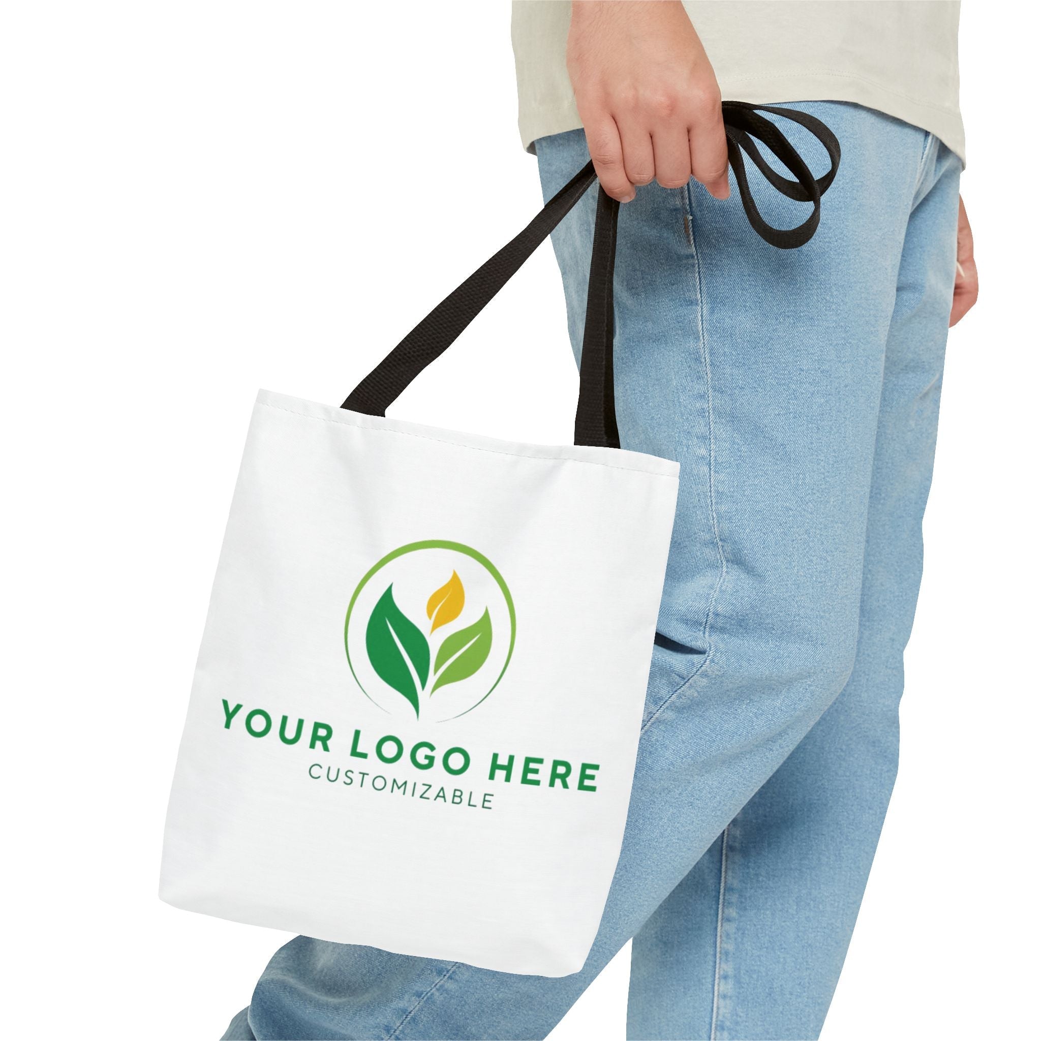 Customizable Tote Bag: Person Holding White Tote with Logo and Text. Black Straps.