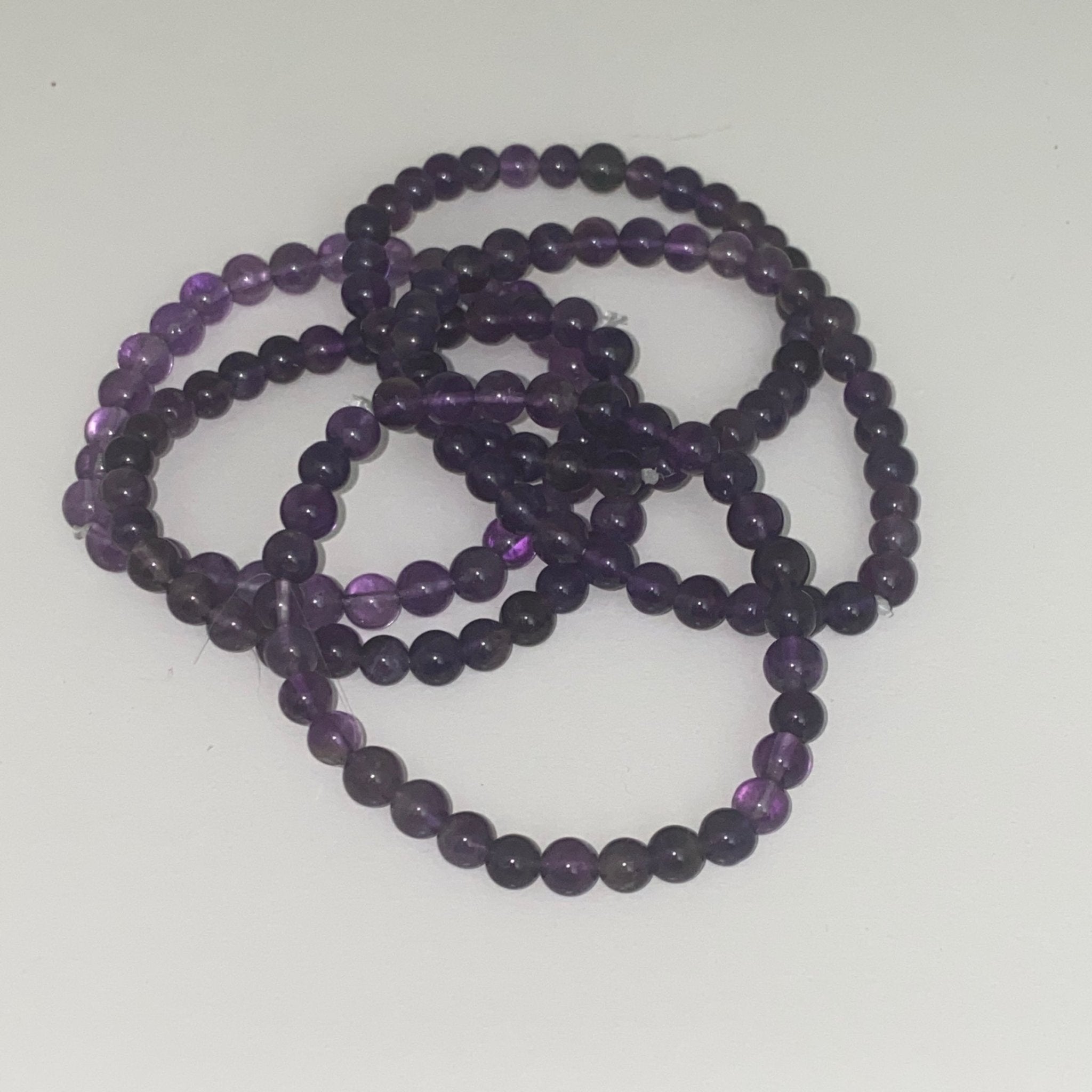 Handmade Amethyst bracelet with 6mm purple natural gemstone beads from Hands of Earth Energy