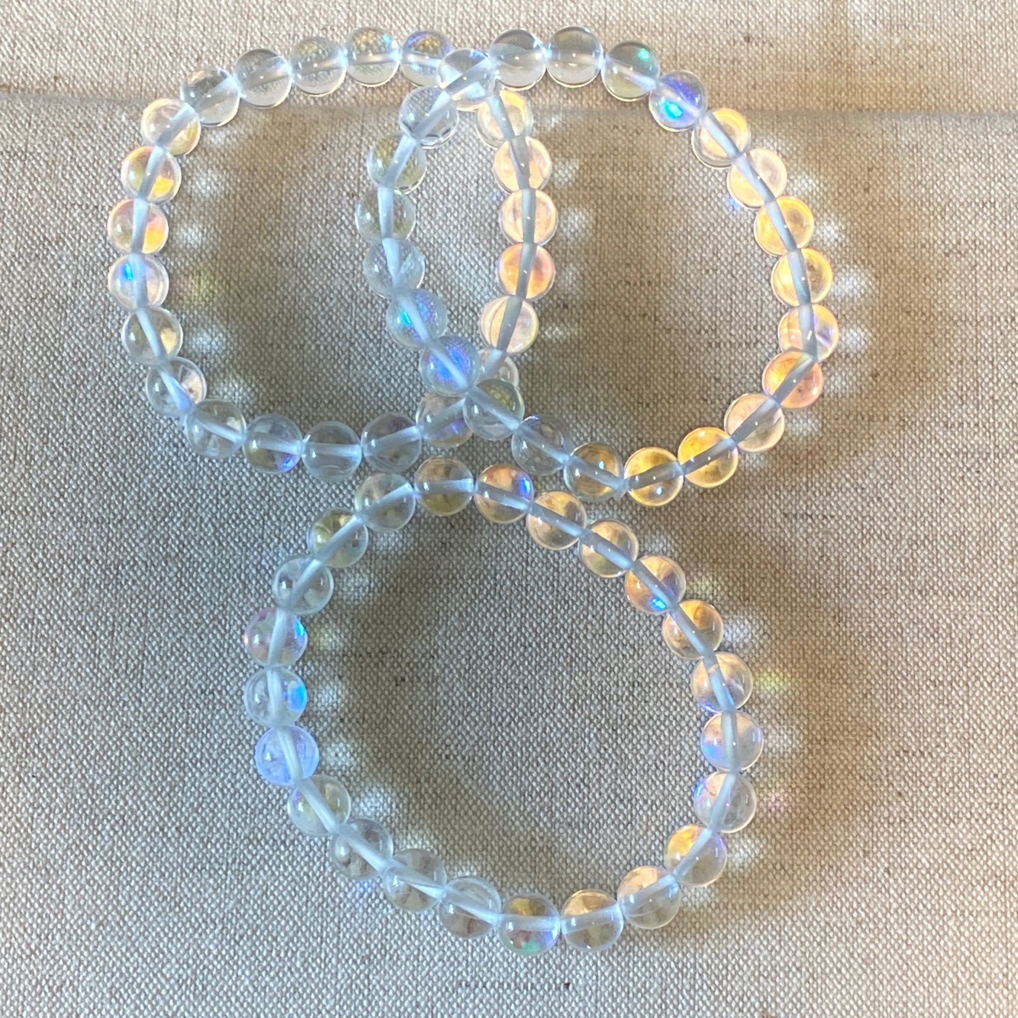Handmade Angel Aura Quartz bracelet with 8mm iridescent gemstone beads from Hands of Earth Energy