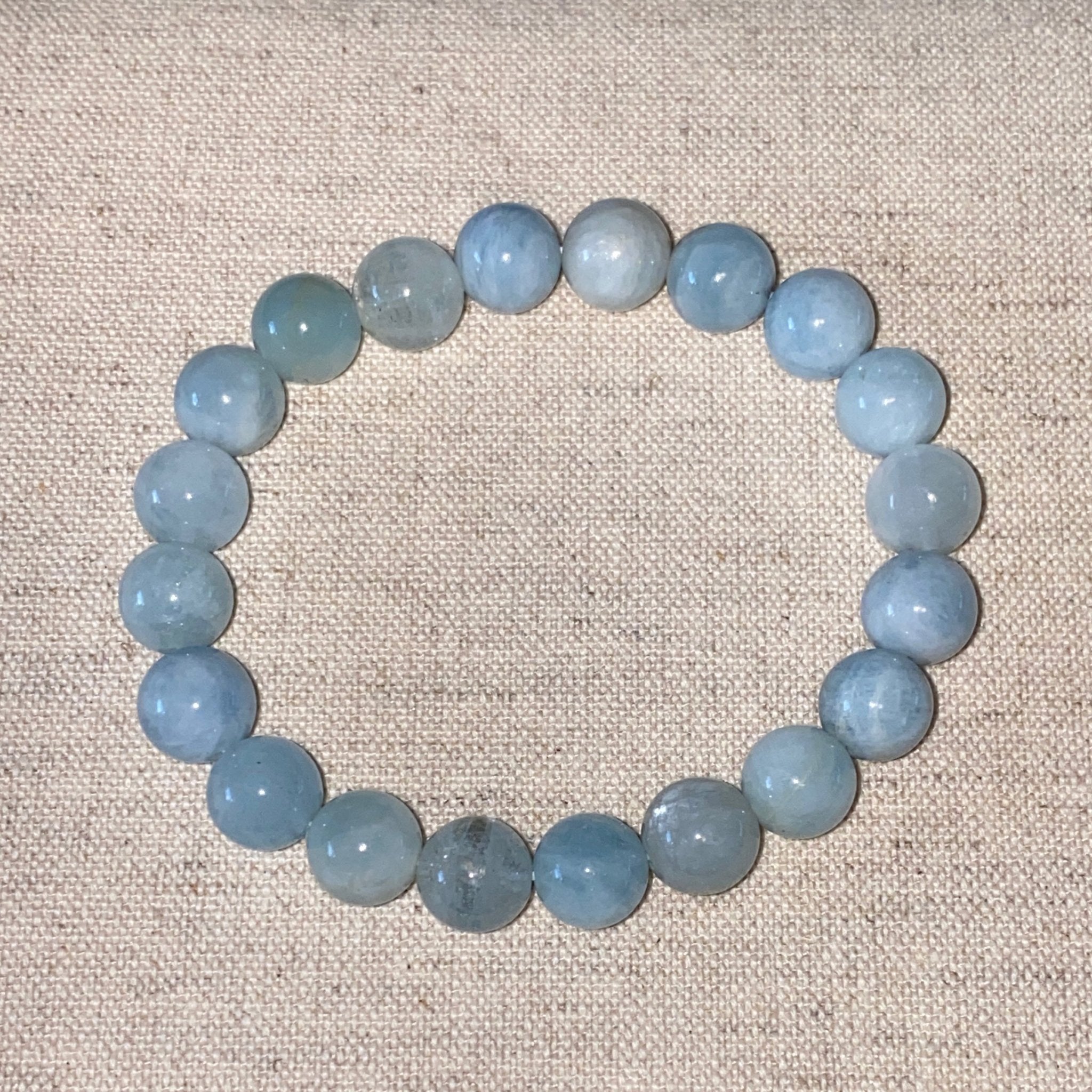Handmade Aquamarine bracelet with 8mm natural sea-colored gemstone beads from Hands of Earth Energy
