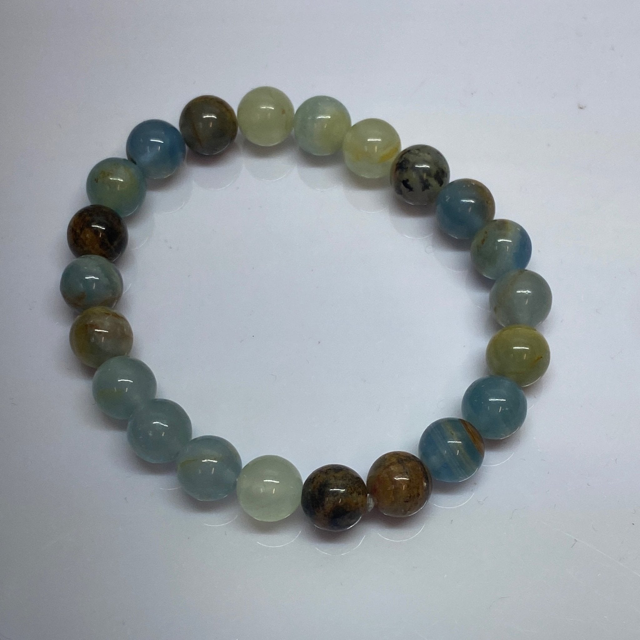 Handmade Blue Onyx bracelet with 8mm dark blue gemstone beads from Hands of Earth Energy