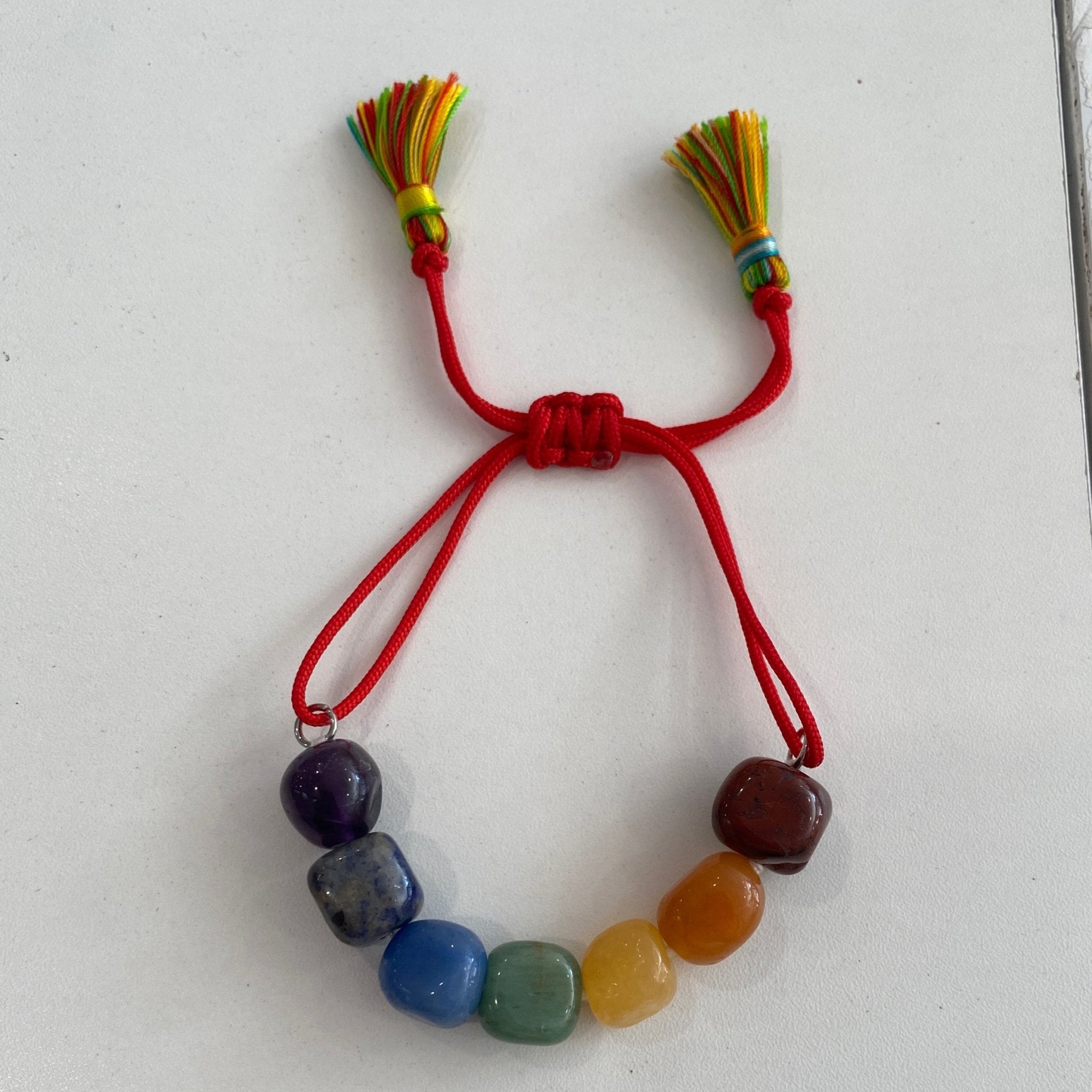 Handmade chakra bracelet with seven natural stones from Hands of Earth Energy