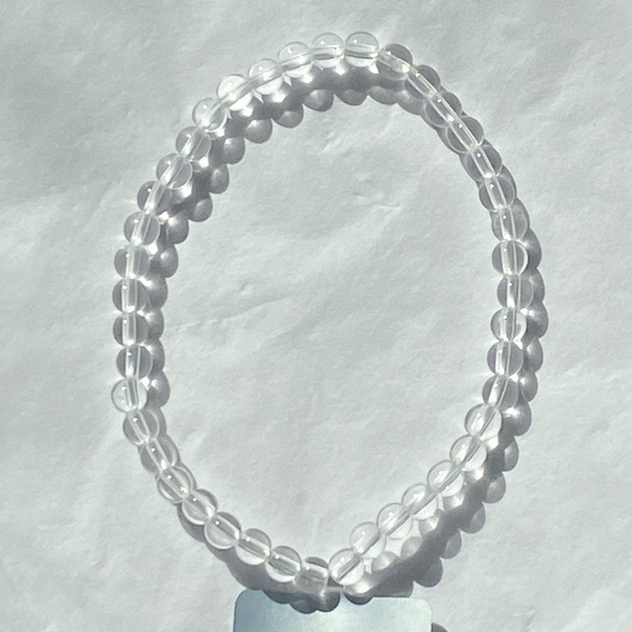 Handmade Clear Quartz bracelet with 4mm round natural gemstone beads from Hands of Earth Energy

