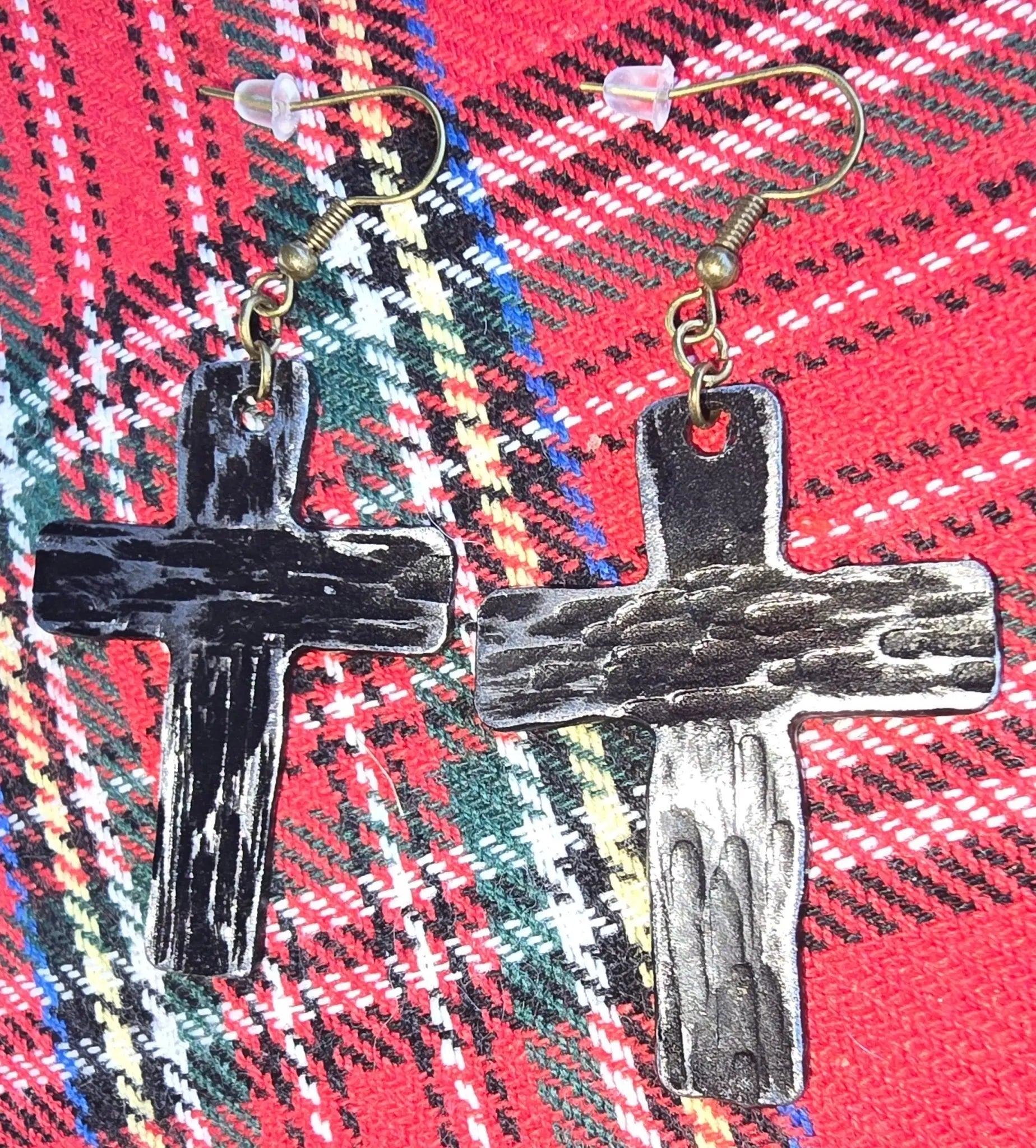 Silver Cross Earrings: Christian Religious Jewelry, Handmade Silver Plated Crosses on Plaid Background.
