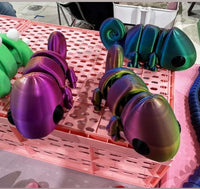 Close-up of chameleon 3D printed toy showing color-changing surface – Mississippi handmade