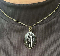 Close-up of oval relic-style pendant on 16 inch chain – Mississippi handmade fantasy jewelry