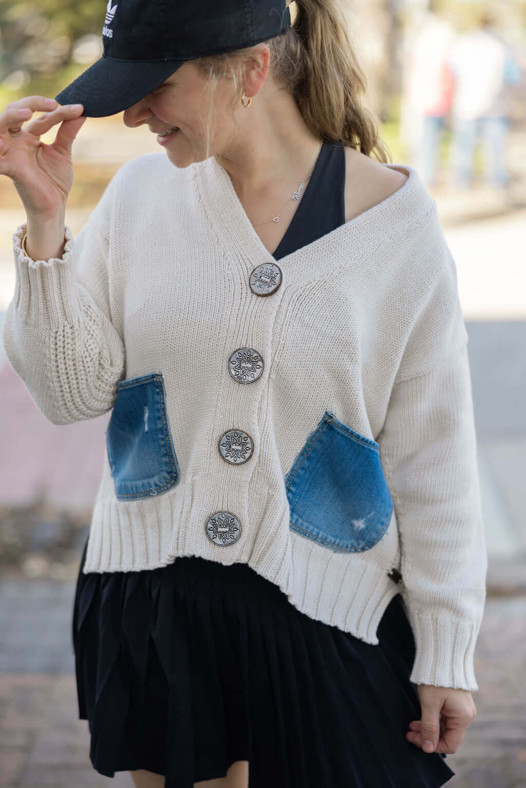 Close-up of coconut buttons and patchwork on Rockstar Cardigan from Keep It Trendy.