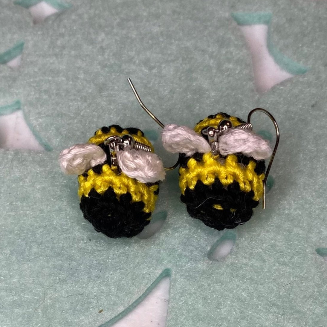 Detailed crochet bee earrings with hypoallergenic cotton design.
