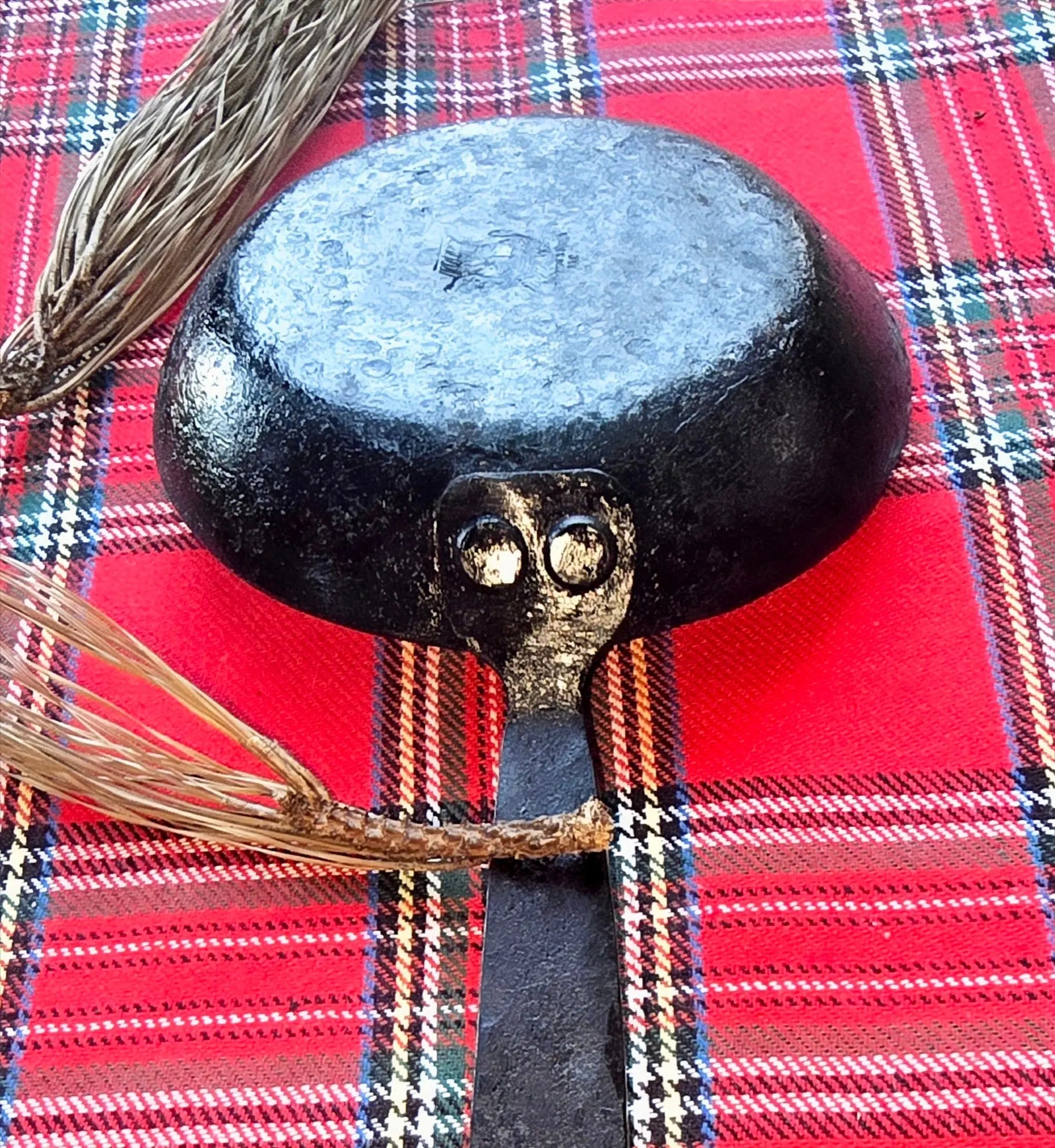 Hand-Forged Iron Egg Skillet by Redbeard's Forge: Durable Cookware with High Heat Retention & Versatility on Red Plaid