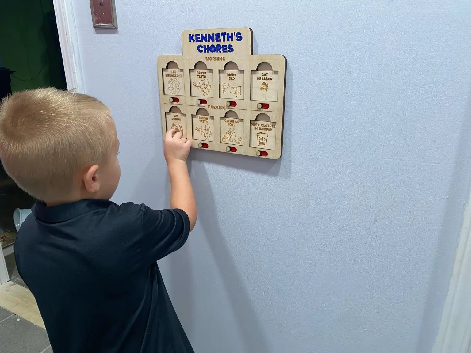 Kenneth's Chore Chart: Kid using daily responsibility tracker for morning & evening tasks. Learning responsibility, fun chore chart.