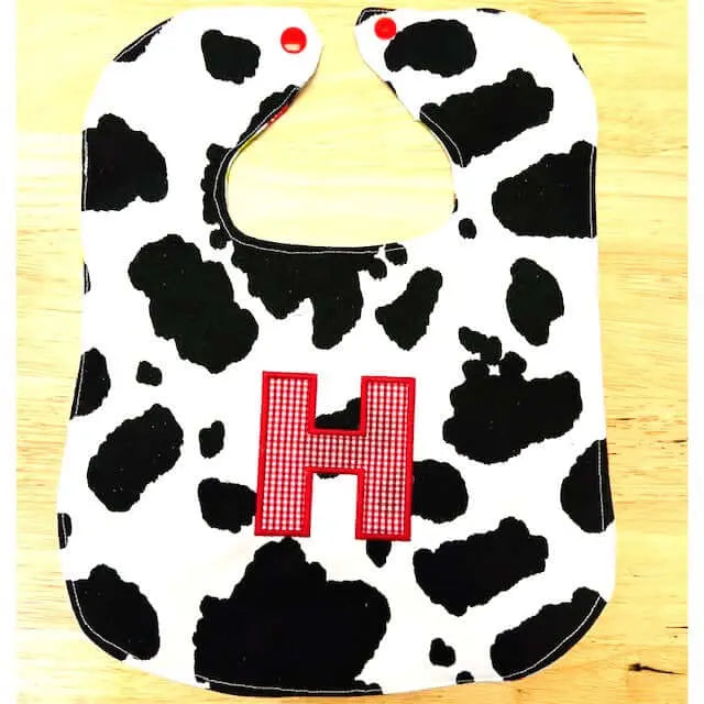 Personalized Handmade Baby Bib - Cow Print with Initial 'H' - Main Street Collective