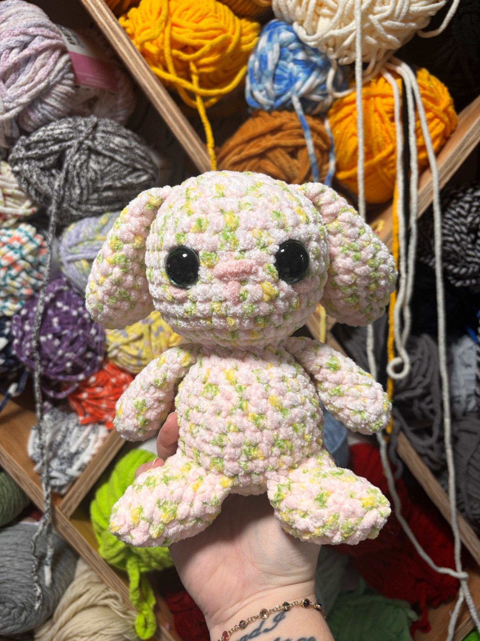 Flower the Rabbit crochet plush with floral patterns and bunny ears.