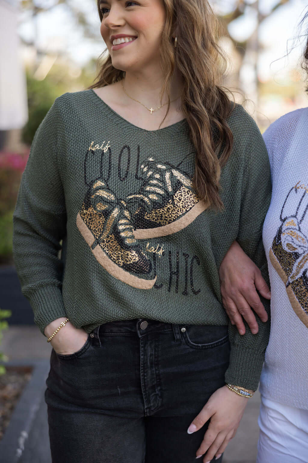 Keep It Trendy Waking the Streets of Italy sweater. Olive green knit top with sneaker graphic. Boutique Italian style.