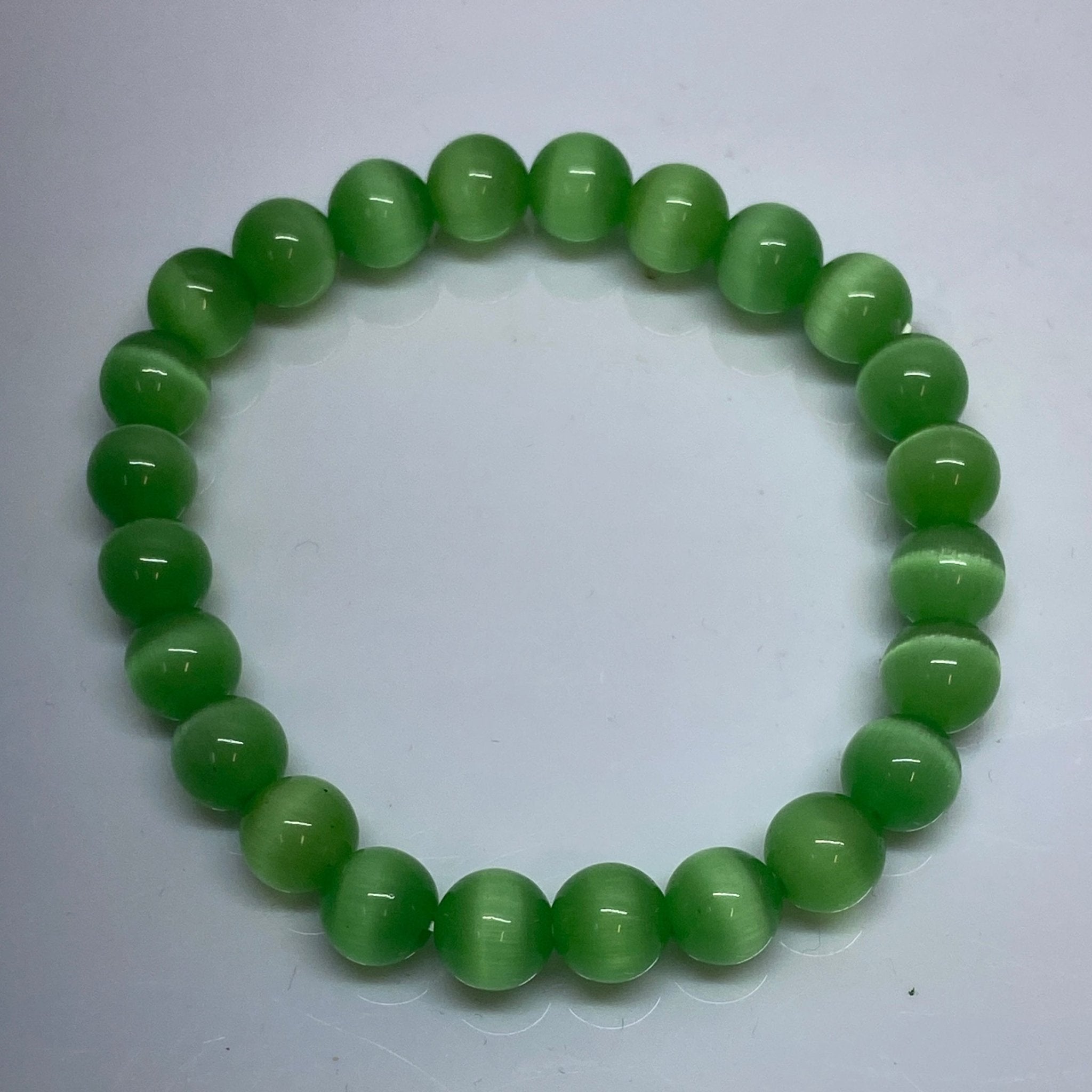 Handmade Green Cat Eye bracelet with 8mm shimmering gemstone beads from Hands of Earth Energy

