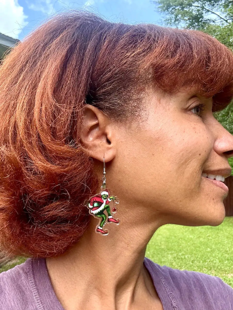 Grinch Earrings: Woman wearing Christmas earrings from Main Street Collective, holiday jewelry