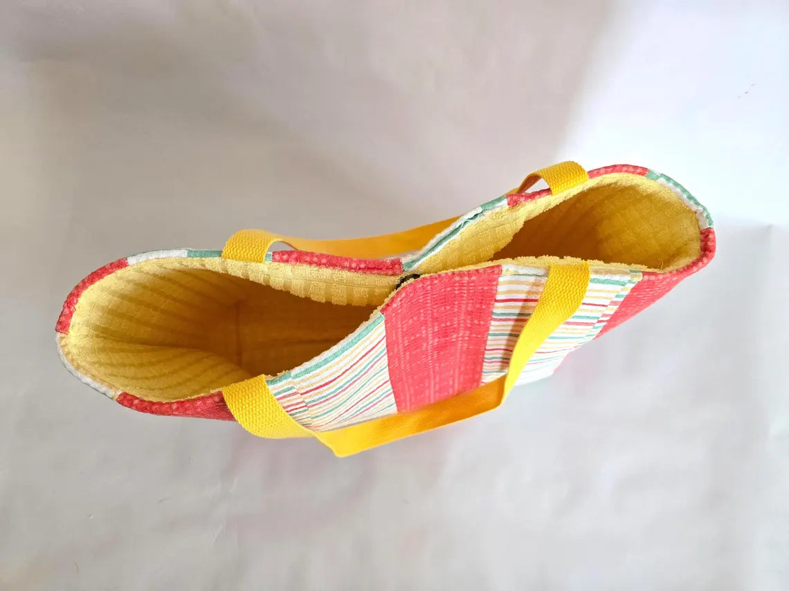 Terry cloth beach tote: striped pool bag with yellow straps, handmade. Coral, yellow, white, and pastel stripes on the exterior.