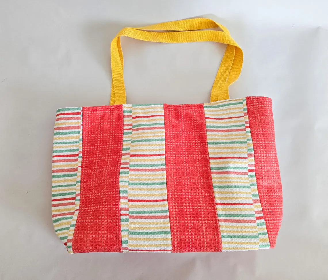 Terry cloth beach tote with coral and pastel stripes and yellow straps, handmade.