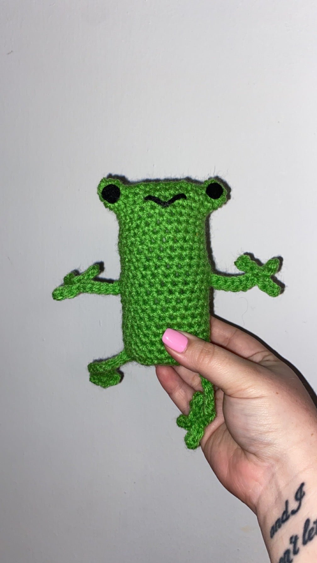 Handmade crochet leggy frog plush - cute amigurumi toy.