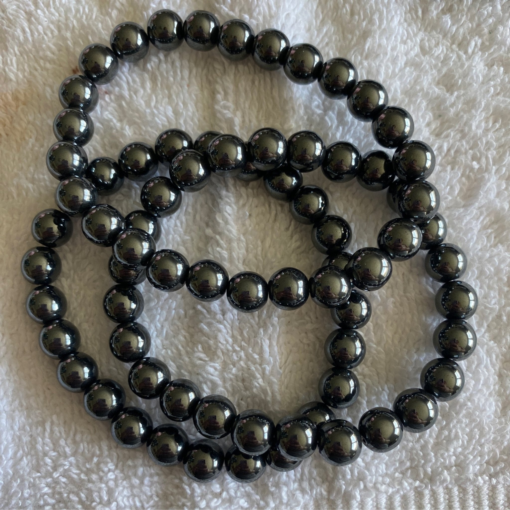 Handmade Hematite bracelet with 8mm metallic natural gemstone beads from Hands of Earth Energy