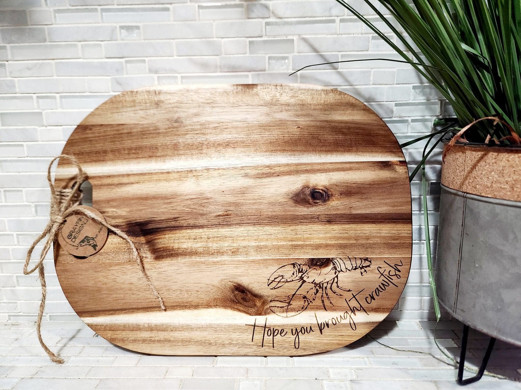 Wooden serving tray with crawfish design and 'Hope you brought crawfish' inscription.