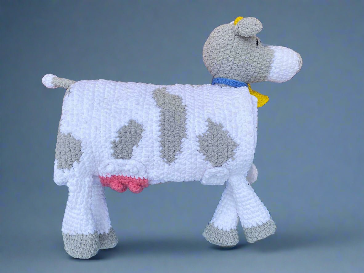 Handmade crochet cow blanket: Soft, cozy, and unique. 3-in-1 blanket, play mat & amigurumi toy.  Handcrafted by Main Street Collective.