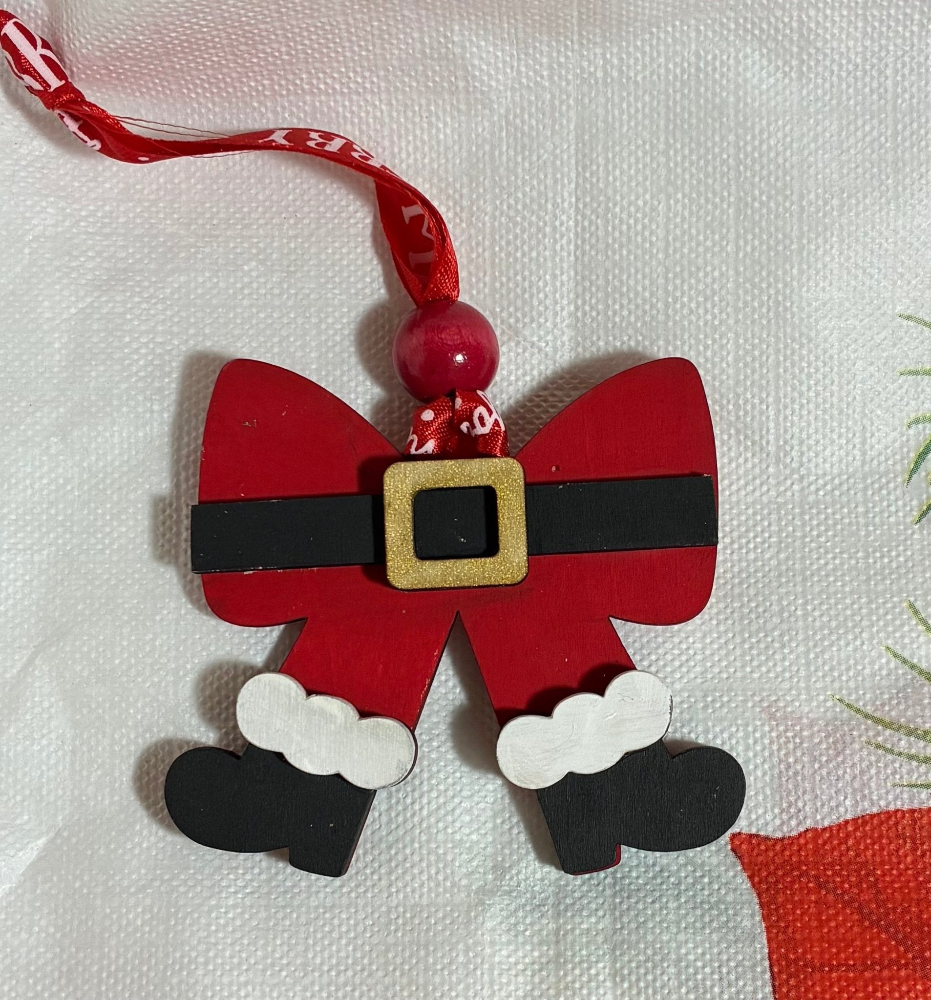 Hand-Painted Wooden Christmas Ornament: Santa Suit Bow Decoration - Main Street Collective