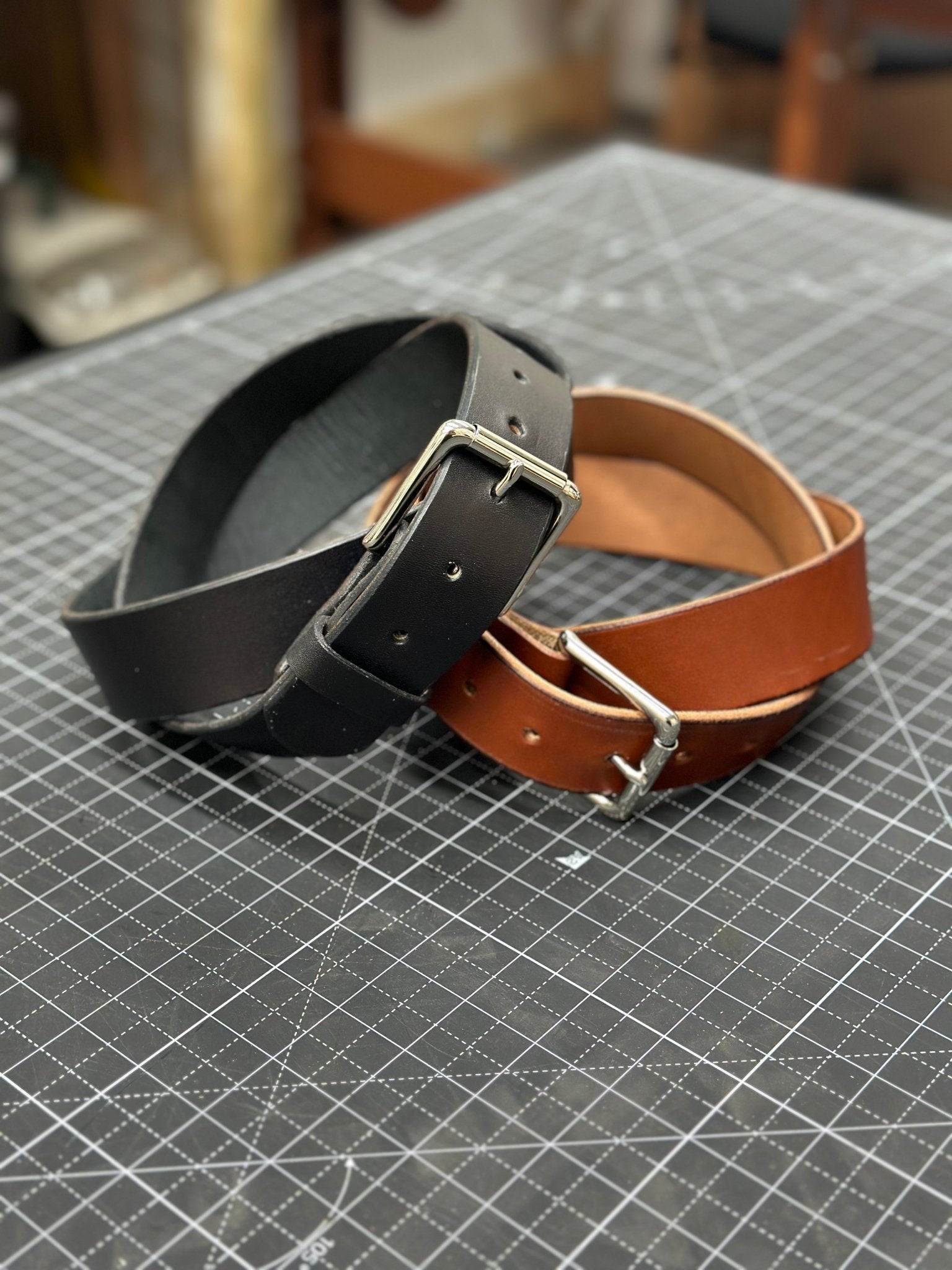 Leather Belts: Handmade Black & Brown Belts with Silver Buckles on Cutting Mat. Quality Full Grain Leather Belt for Men & Women