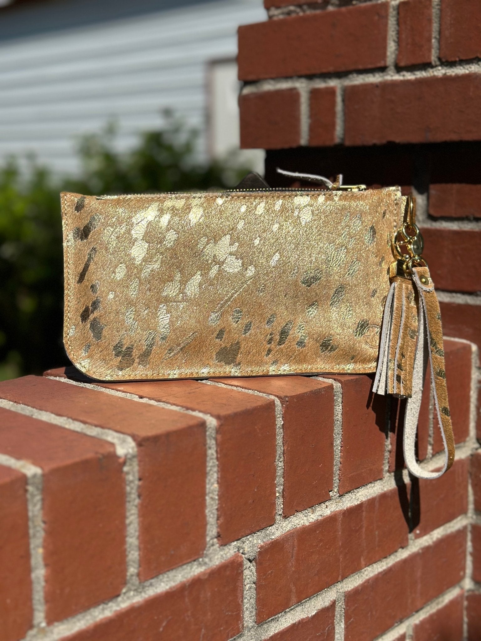 Gold Leather Clutch with Tassel by Main Street Collective. Stylish Handbag, Shop now!