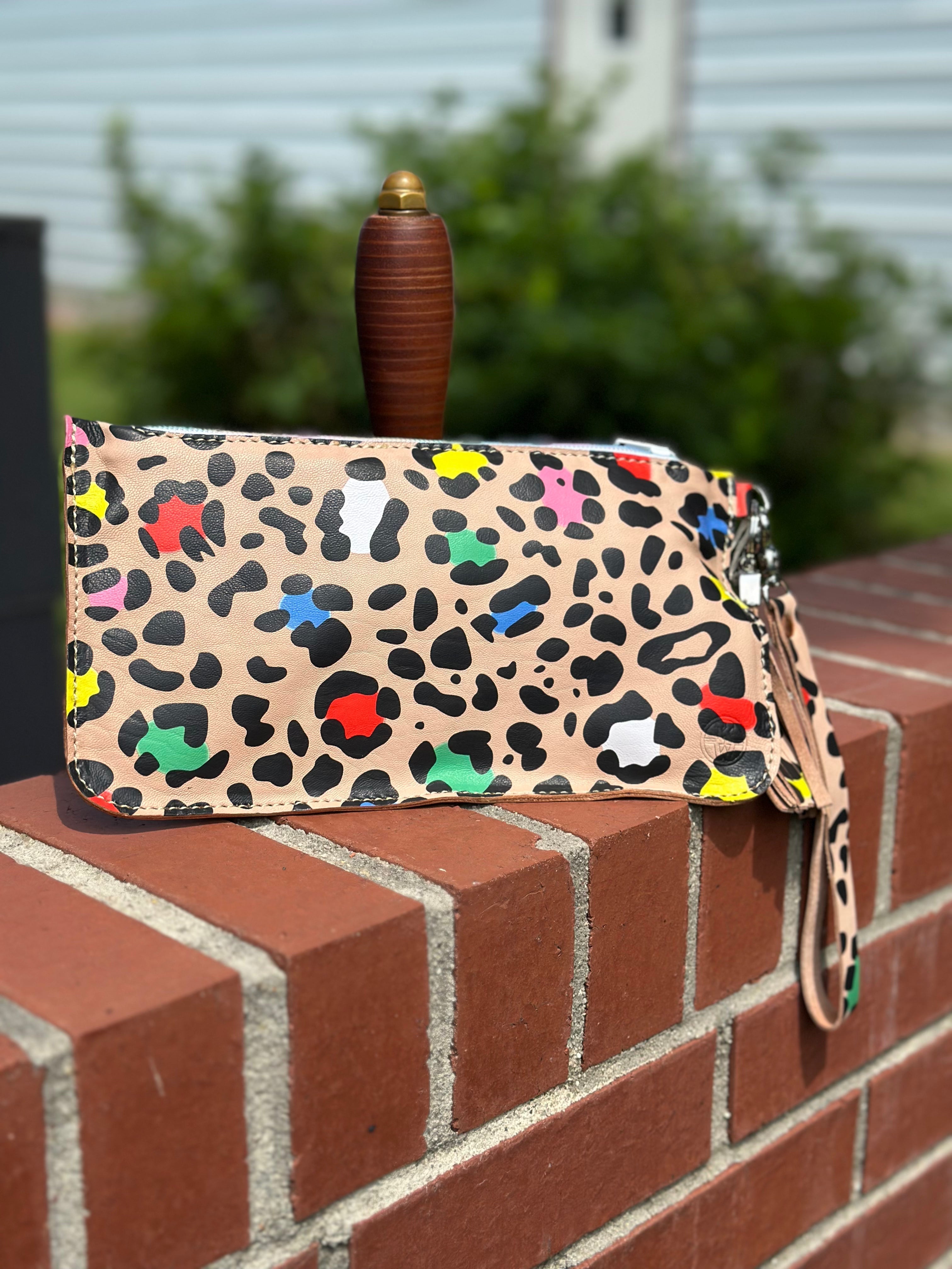 Main Street Collective Leather Clutch: Handmade colorful leopard print clutch with inside pocket.