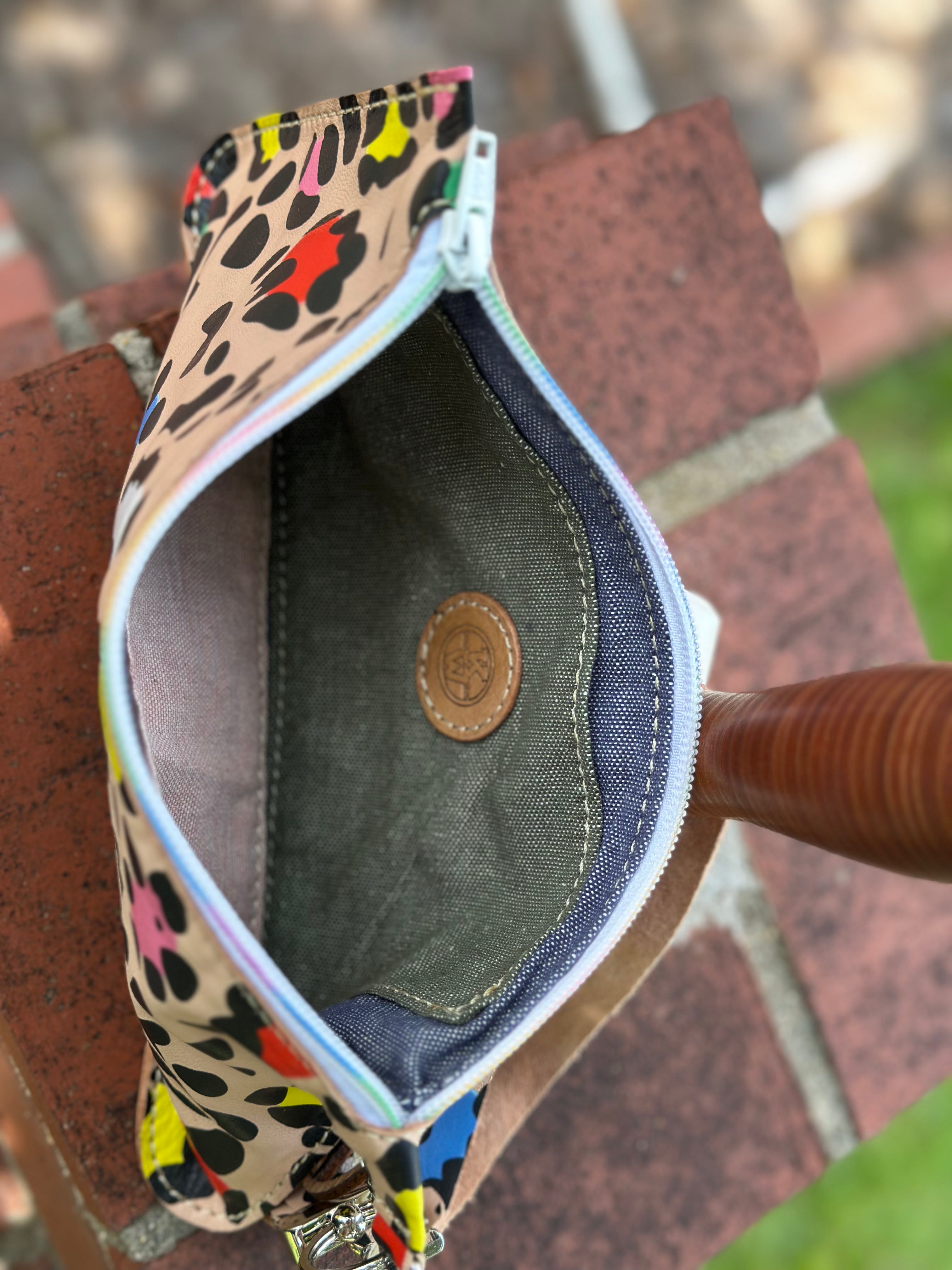 Leopard Print Leather Clutch by Main Street Collective: Designer Handbag with Inside Pocket & Zipper Closure, Stylish Accessories.