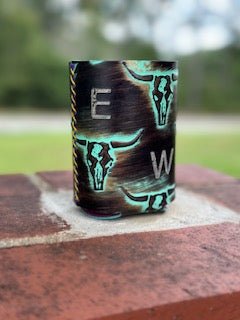 Custom branded cowhide can cooler with turquoise accents, available at Main Street Collective. Personalized drink koozie.