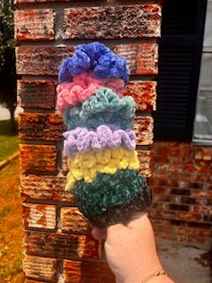 Crocheted Velvet Scrunchies Stack - Handmade hair accessories in blue, pink, teal, lavender, yellow, and green colors