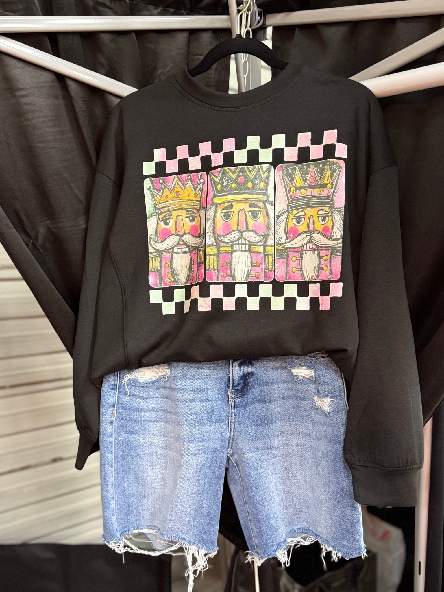 Zenana Black Nutcracker Christmas Sweatshirt from Main Street Collective. Crew neck, relaxed fit with festive nutcracker design.