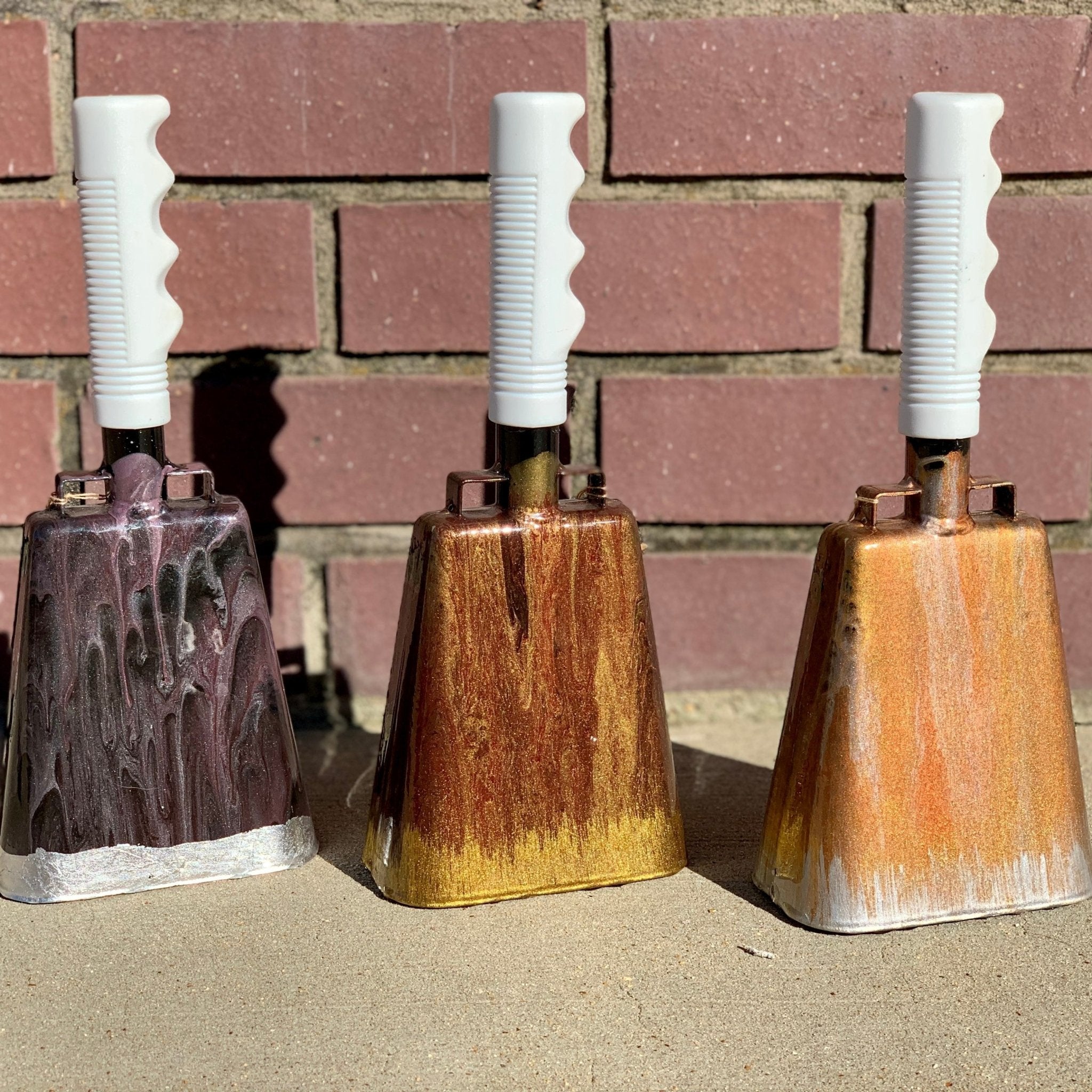 Hand-painted Cowbells by Main Street Collective: Unique Noise Makers for Celebrations & Events.